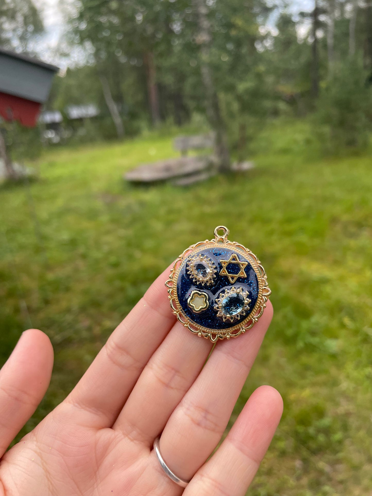 Gema: Stars Magen David with Zirconia, blue and Gold plated Resin Pendant