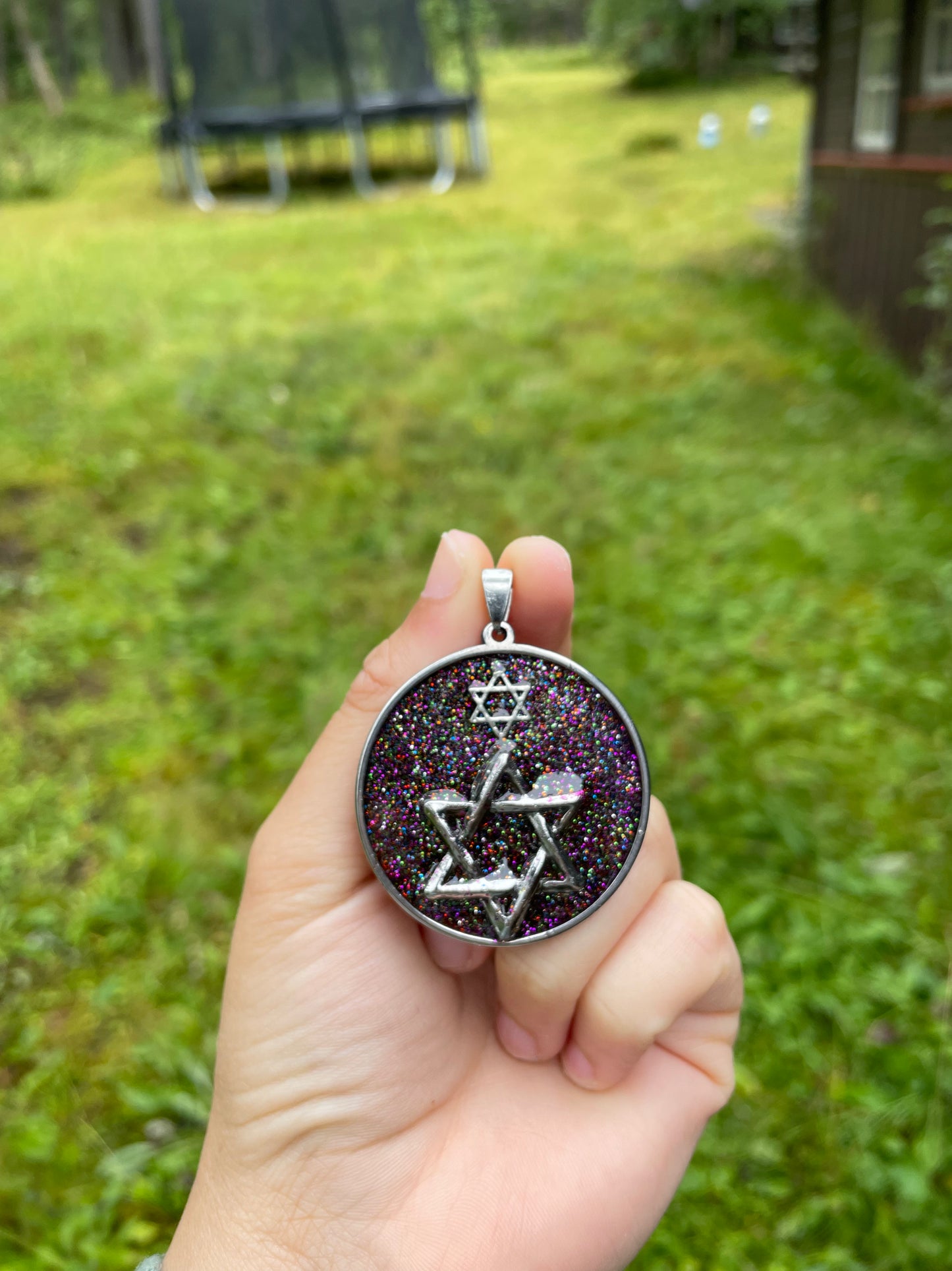 Far Galaxies: Double Magen David Glittery Resin Pendant set in round Stainless Steel Frame
