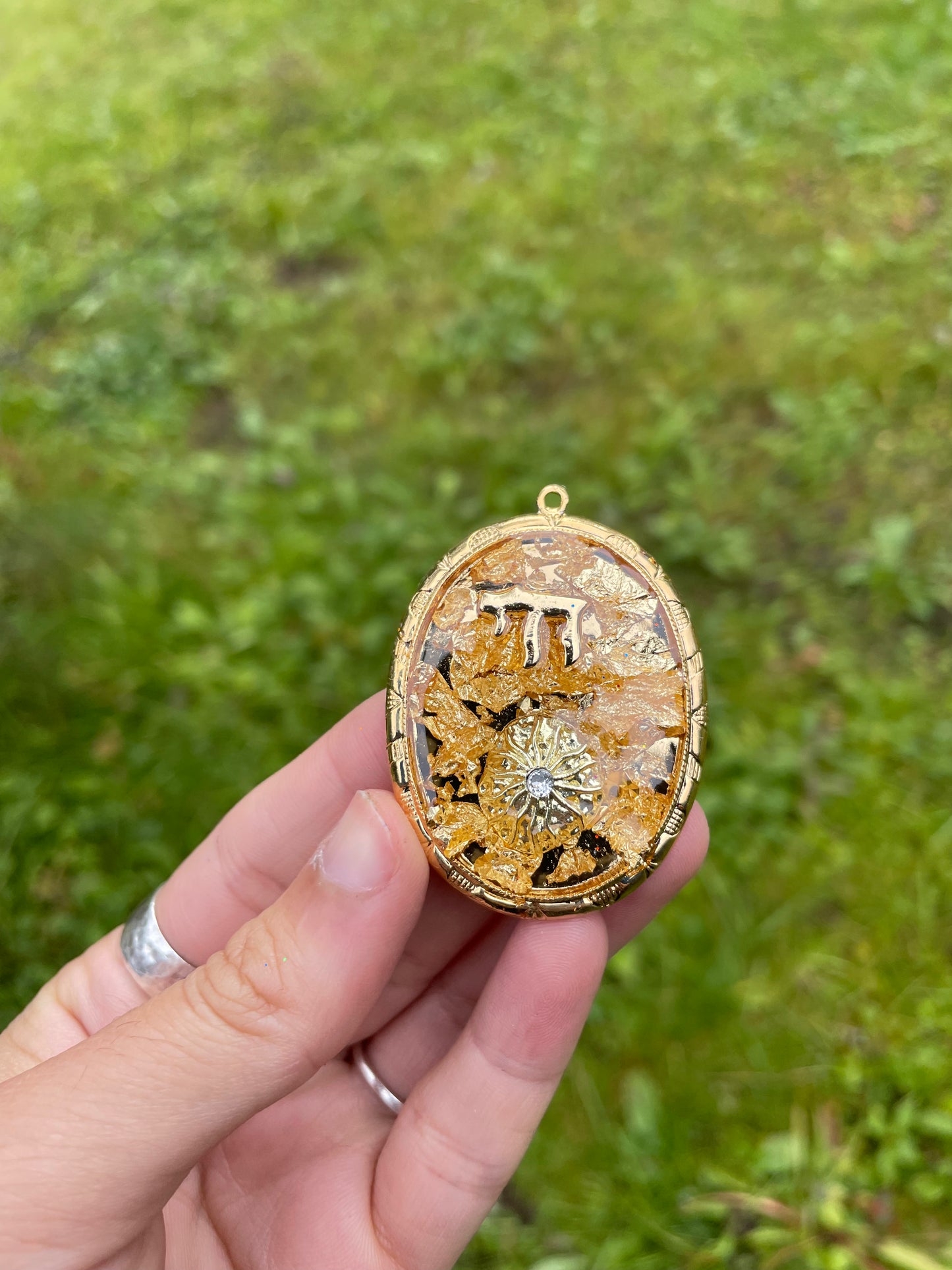 Chai & Sunny Rays pendant with Gold Flakes, Chai and Sun charms in Gold plated Oval Frame