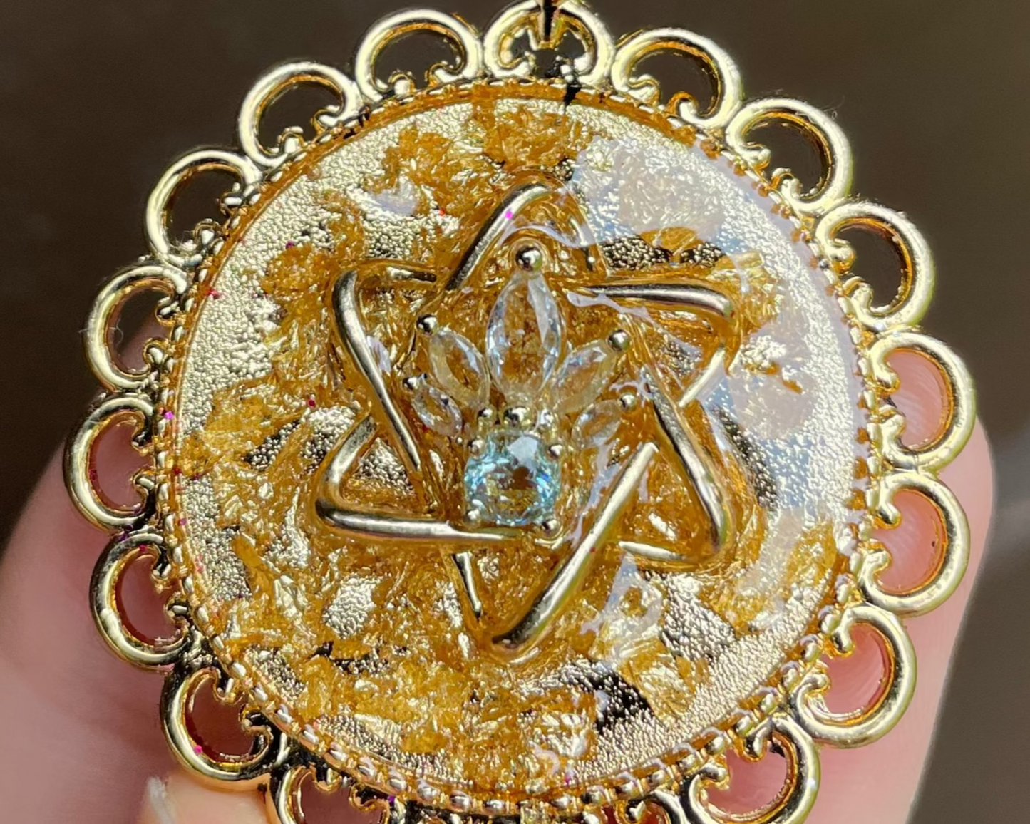 Pearl: Gold plated Magen David, Zirconia Blue Pearl and Gold flakes in Gold Plated Round Pendant