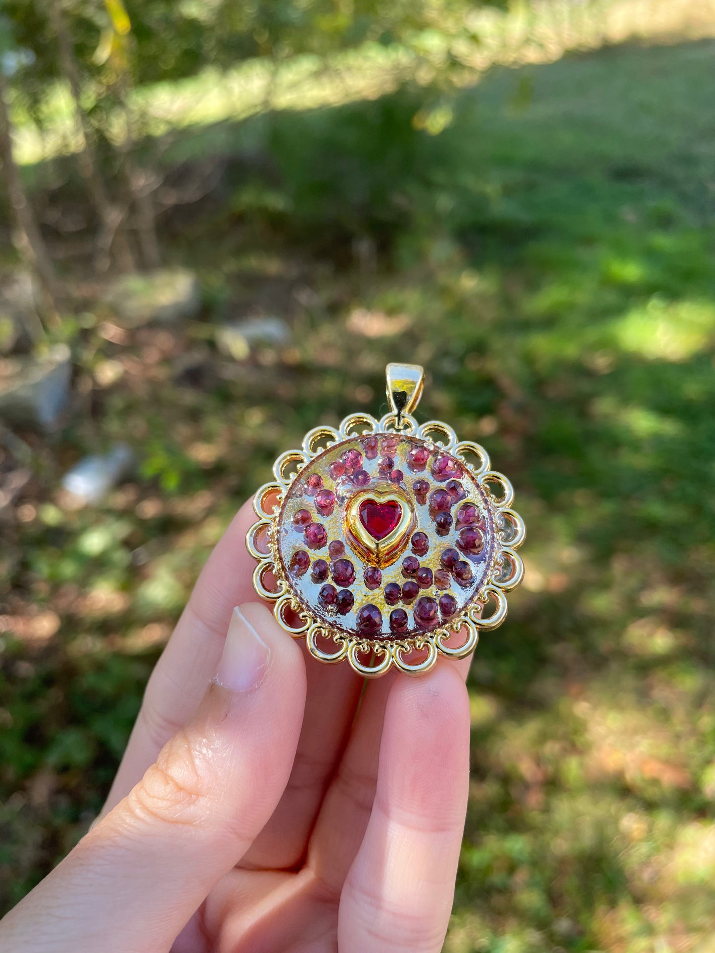 Heart of Garnet Gemstones, Resin, Red Zirconia and Gold Plated Round Decorated Frame