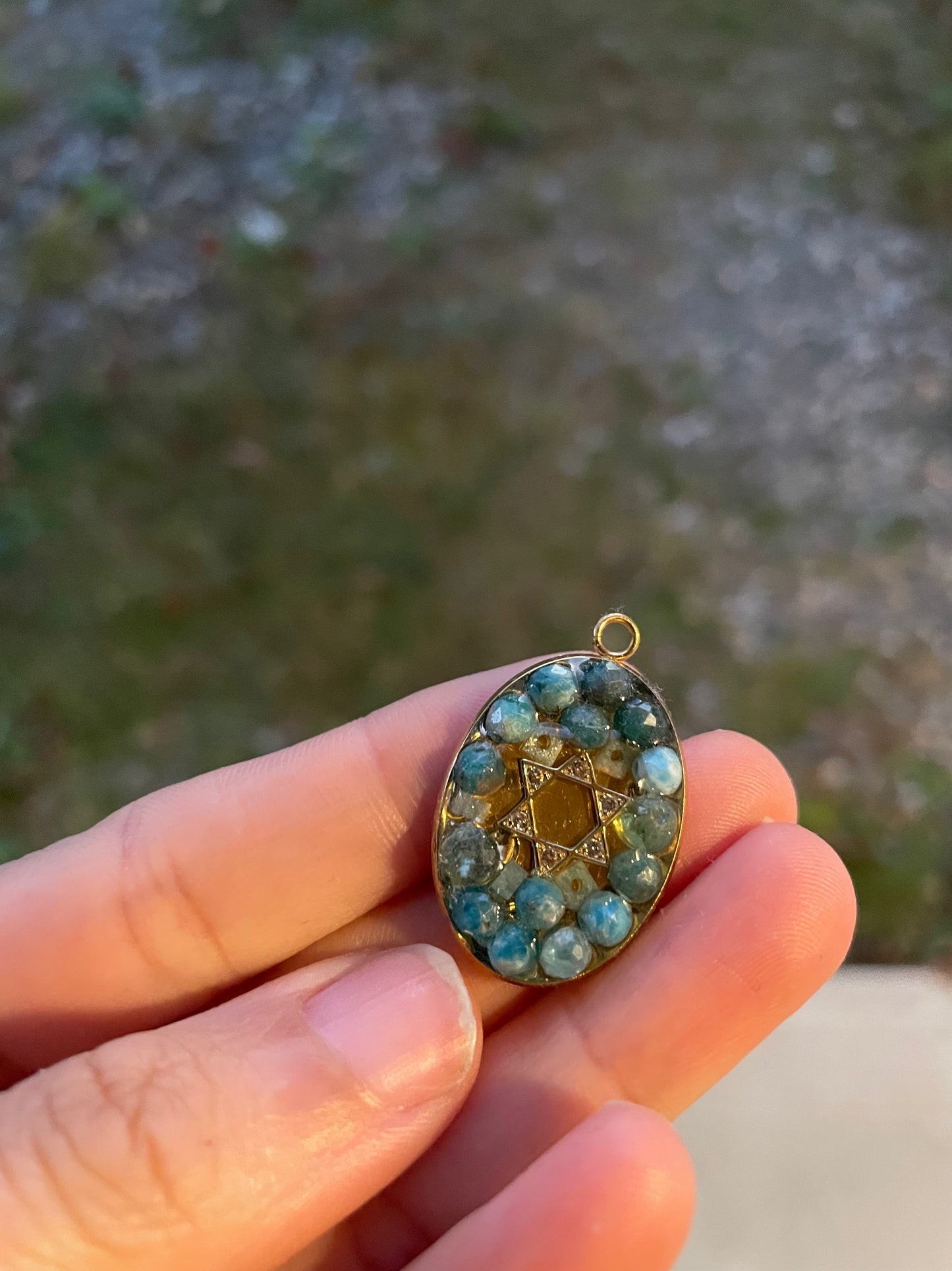 Gold Plated Zirconia Magen David with Blue Apatite Gemstones Oval Resin Pendant