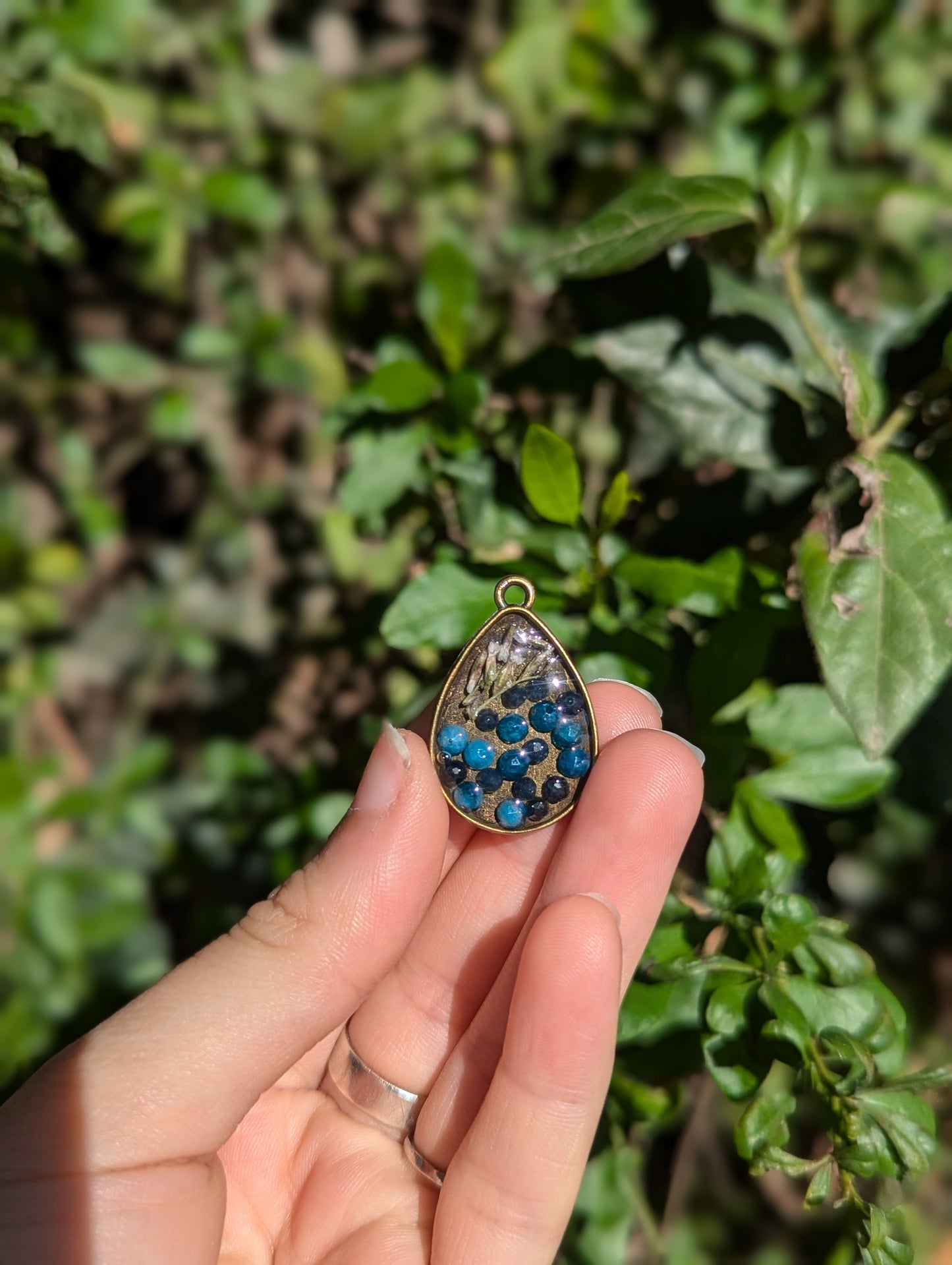 Israel Encapsulated: Drop Resin Pendant with Sapphire and Apatite Gemstones and Israeli White Flowers