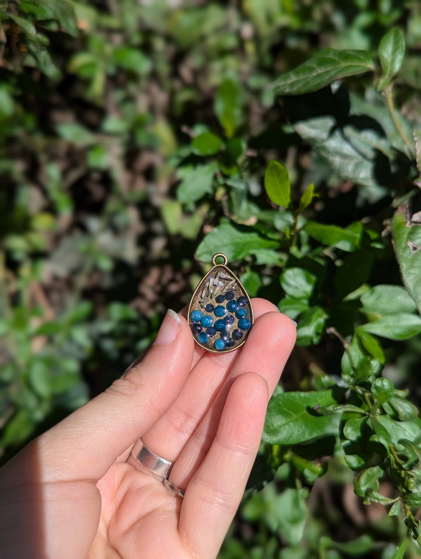 Israel Encapsulated: Drop Resin Pendant with Sapphire and Apatite Gemstones and Israeli White Flowers