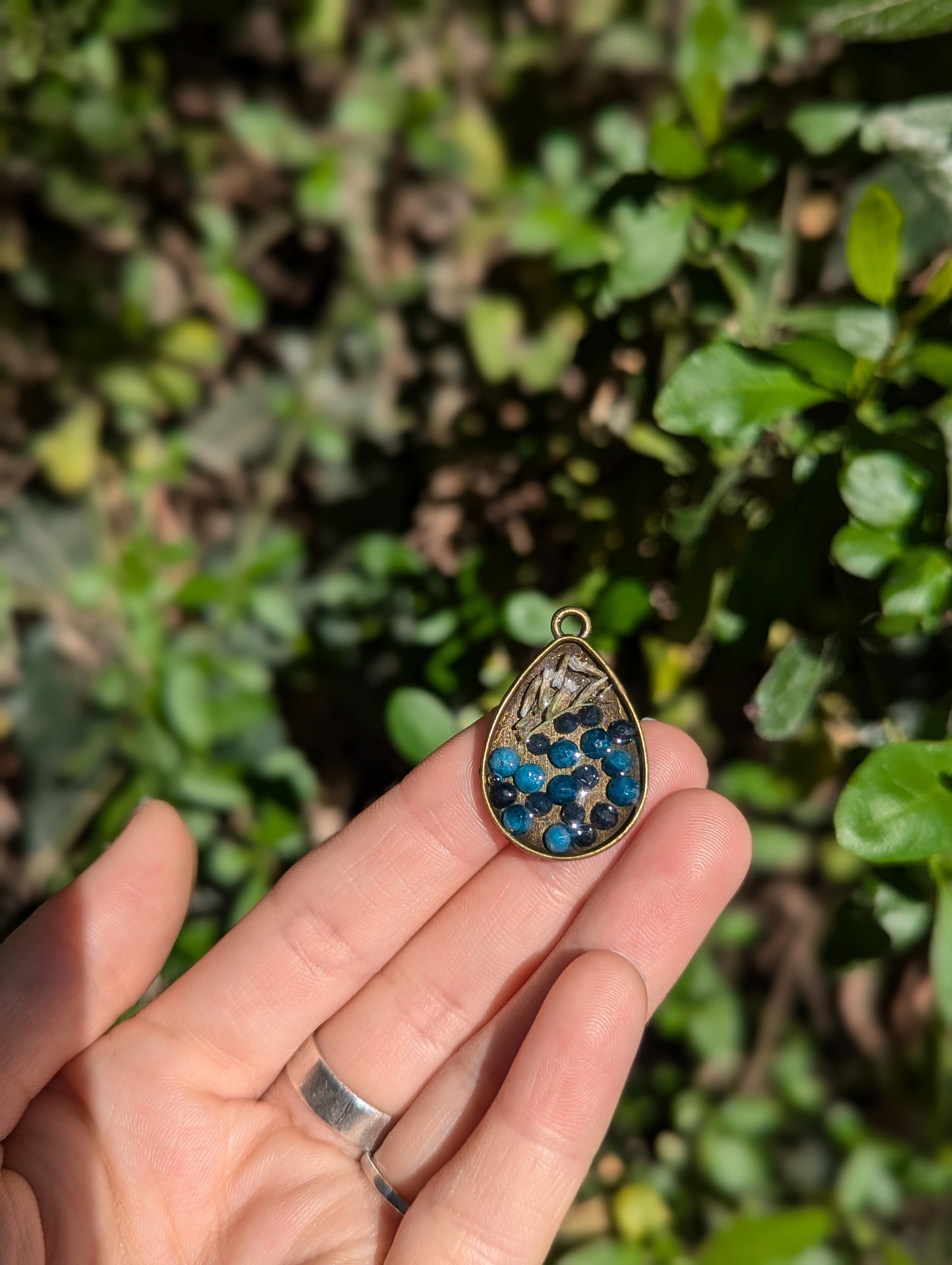 Israel Encapsulated: Drop Resin Pendant with Sapphire and Apatite Gemstones and Israeli White Flowers