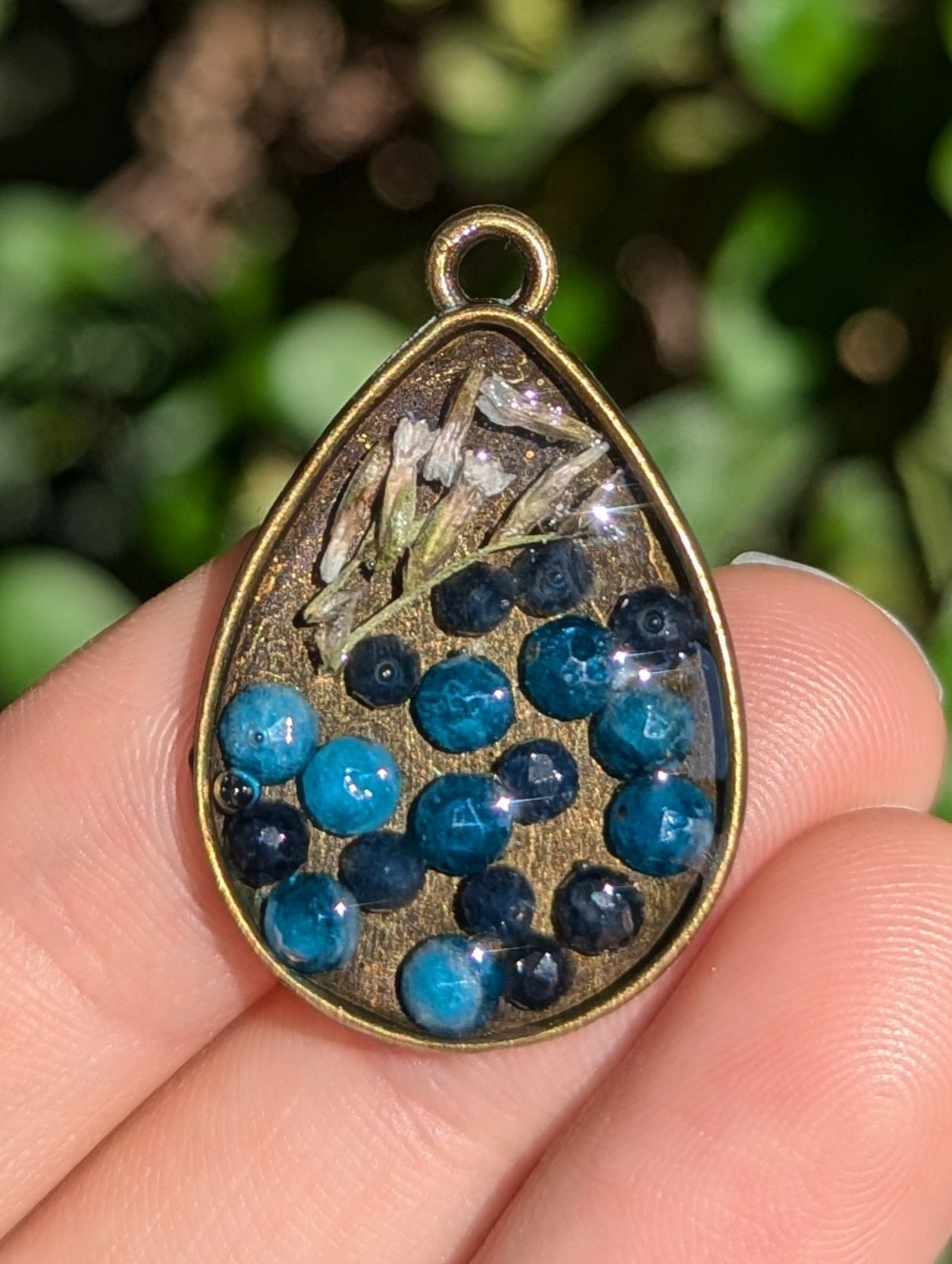 Israel Encapsulated: Drop Resin Pendant with Sapphire and Apatite Gemstones and Israeli White Flowers