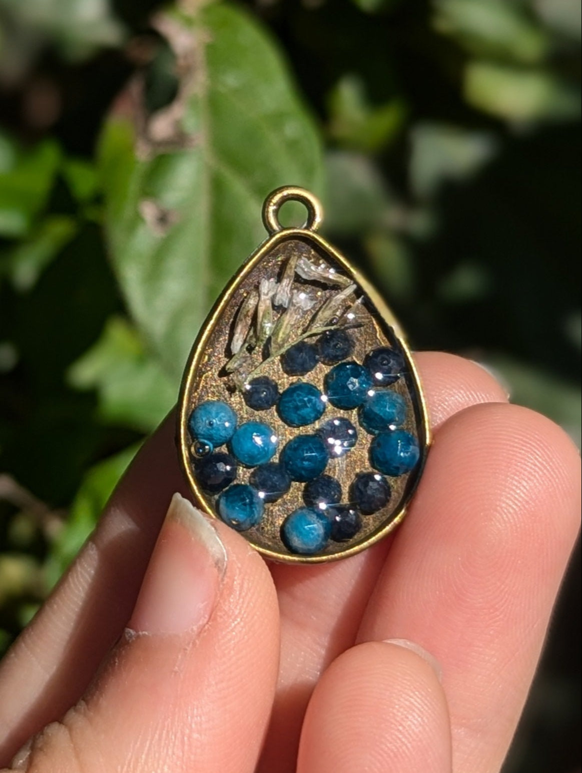 Israel Encapsulated: Drop Resin Pendant with Sapphire and Apatite Gemstones and Israeli White Flowers