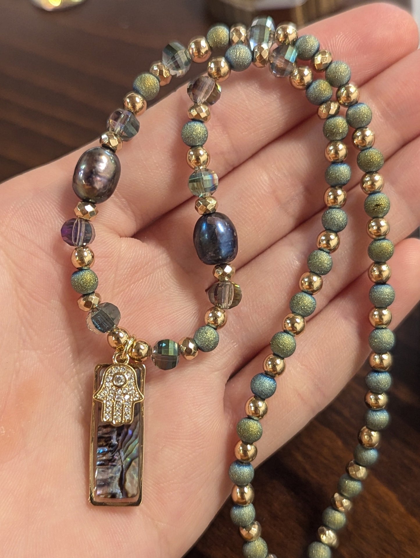 Abalone Shell, Purple Pearls, Gold Hamsa and Green Beads