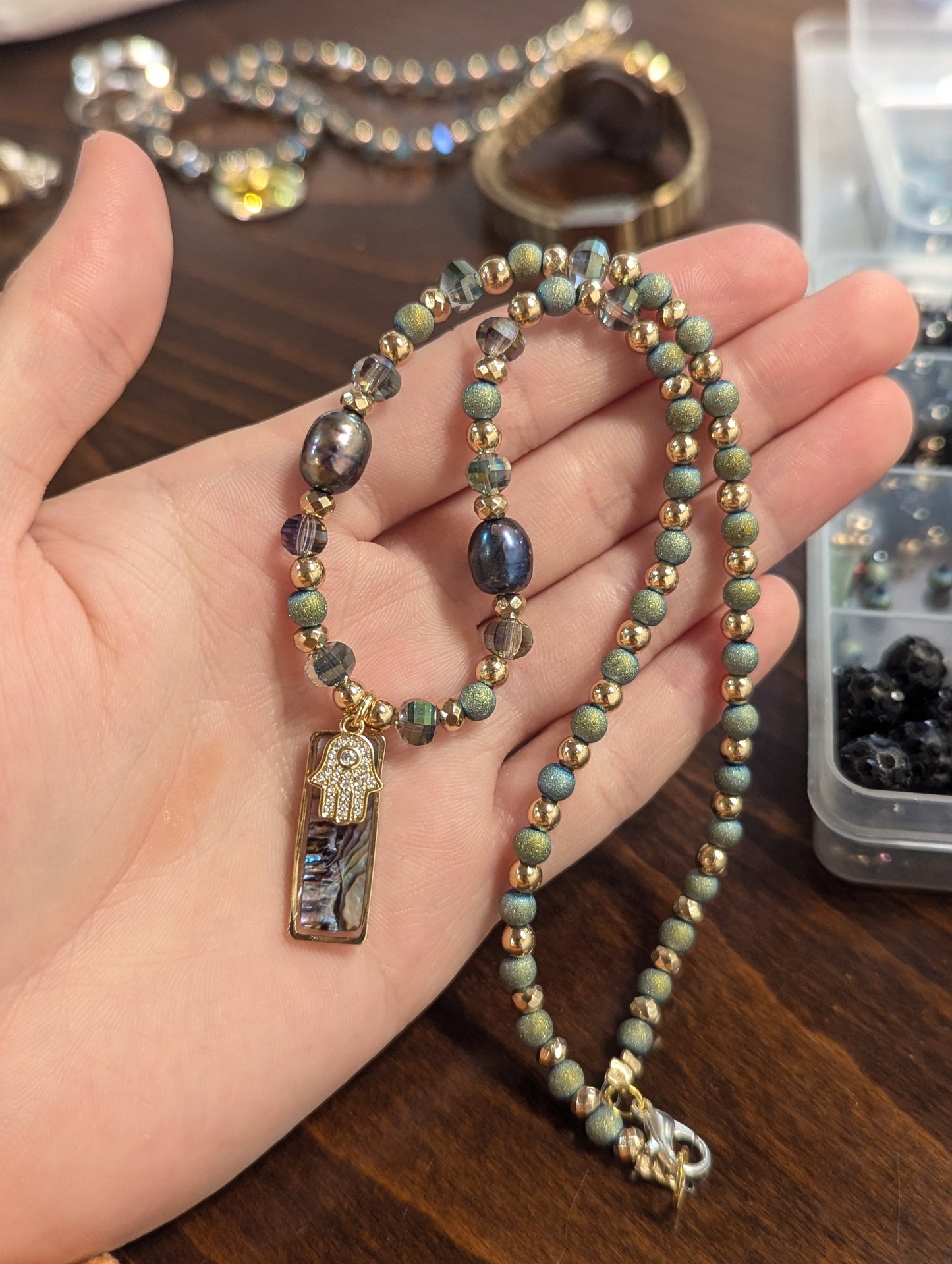 Abalone Shell, Purple Pearls, Gold Hamsa and Green Beads