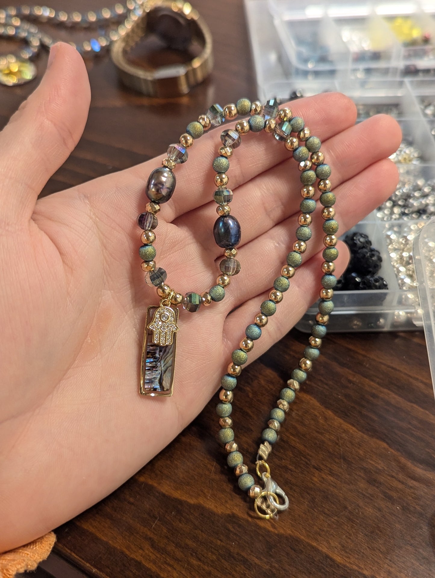 Abalone Shell, Purple Pearls, Gold Hamsa and Green Beads