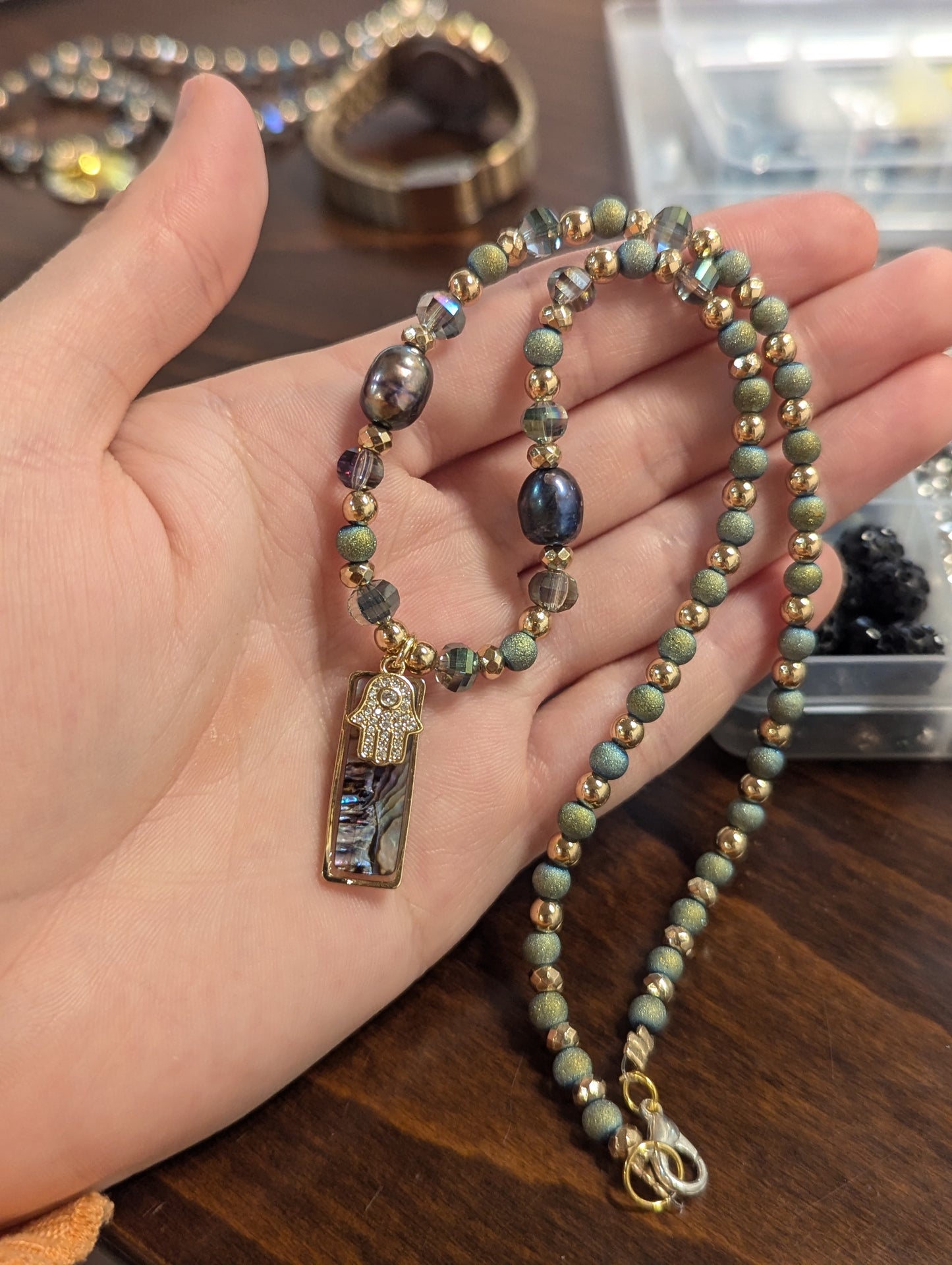 Abalone Shell, Purple Pearls, Gold Hamsa and Green Beads