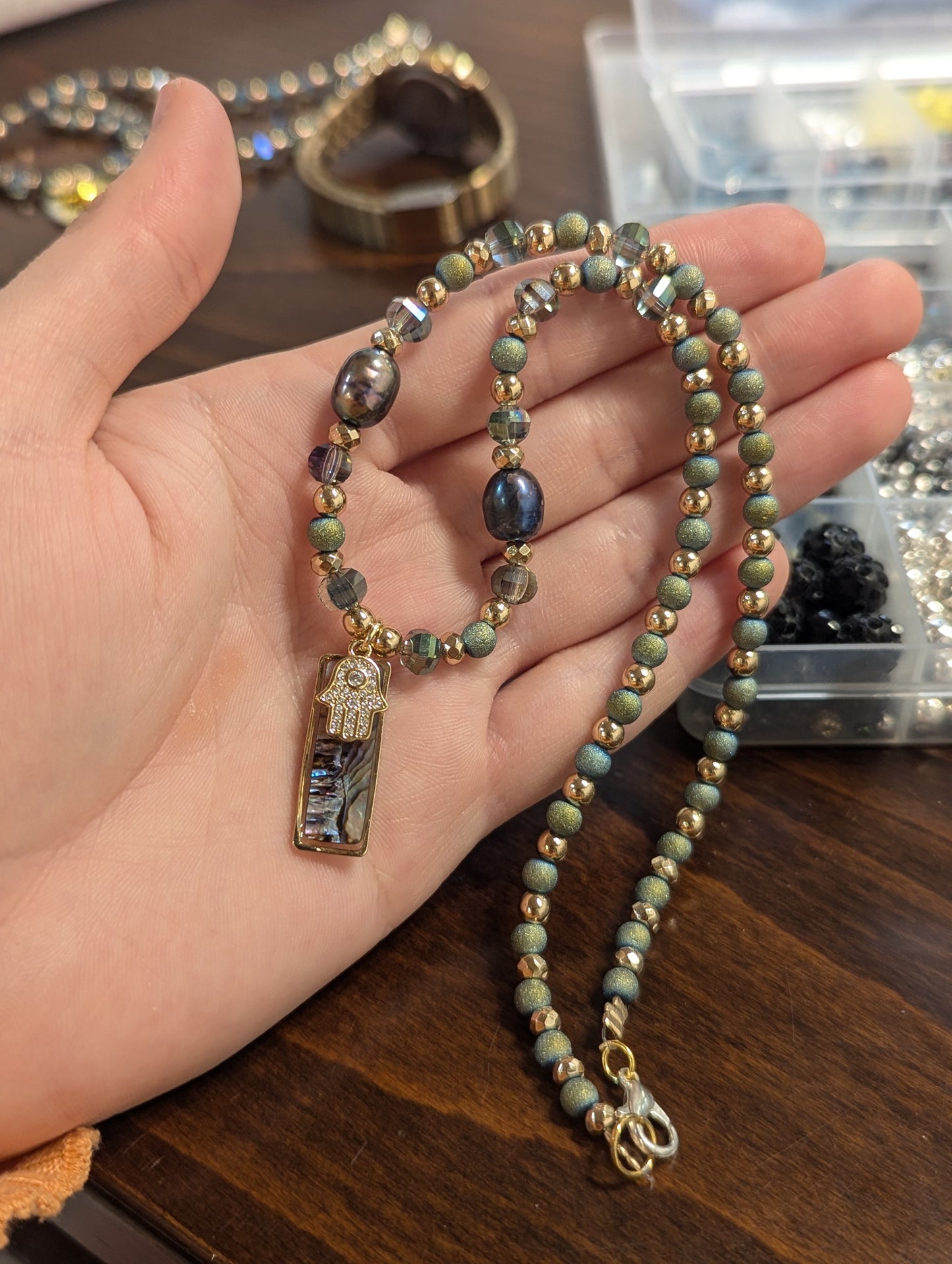 Abalone Shell, Purple Pearls, Gold Hamsa and Green Beads