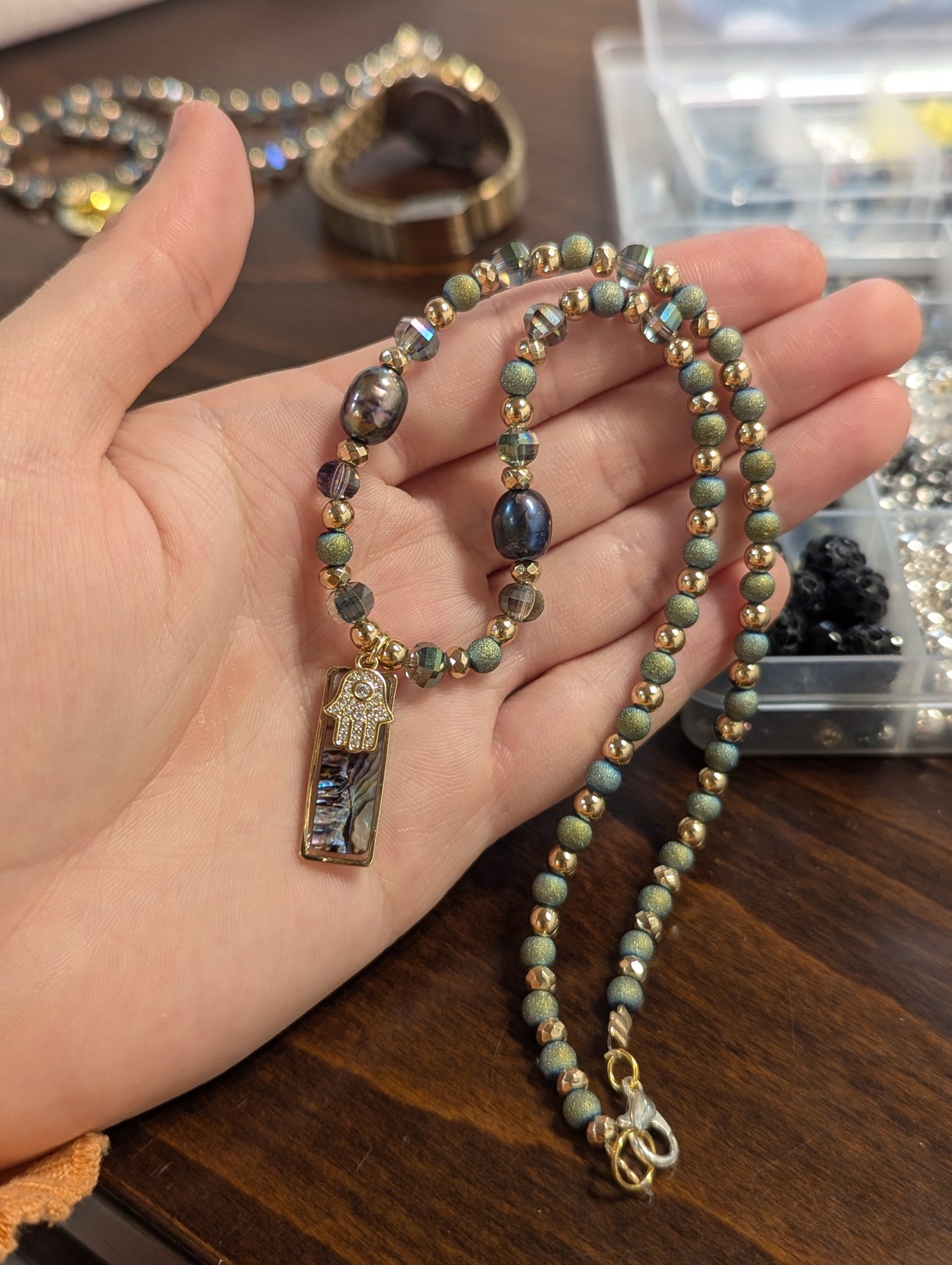Abalone Shell, Purple Pearls, Gold Hamsa and Green Beads
