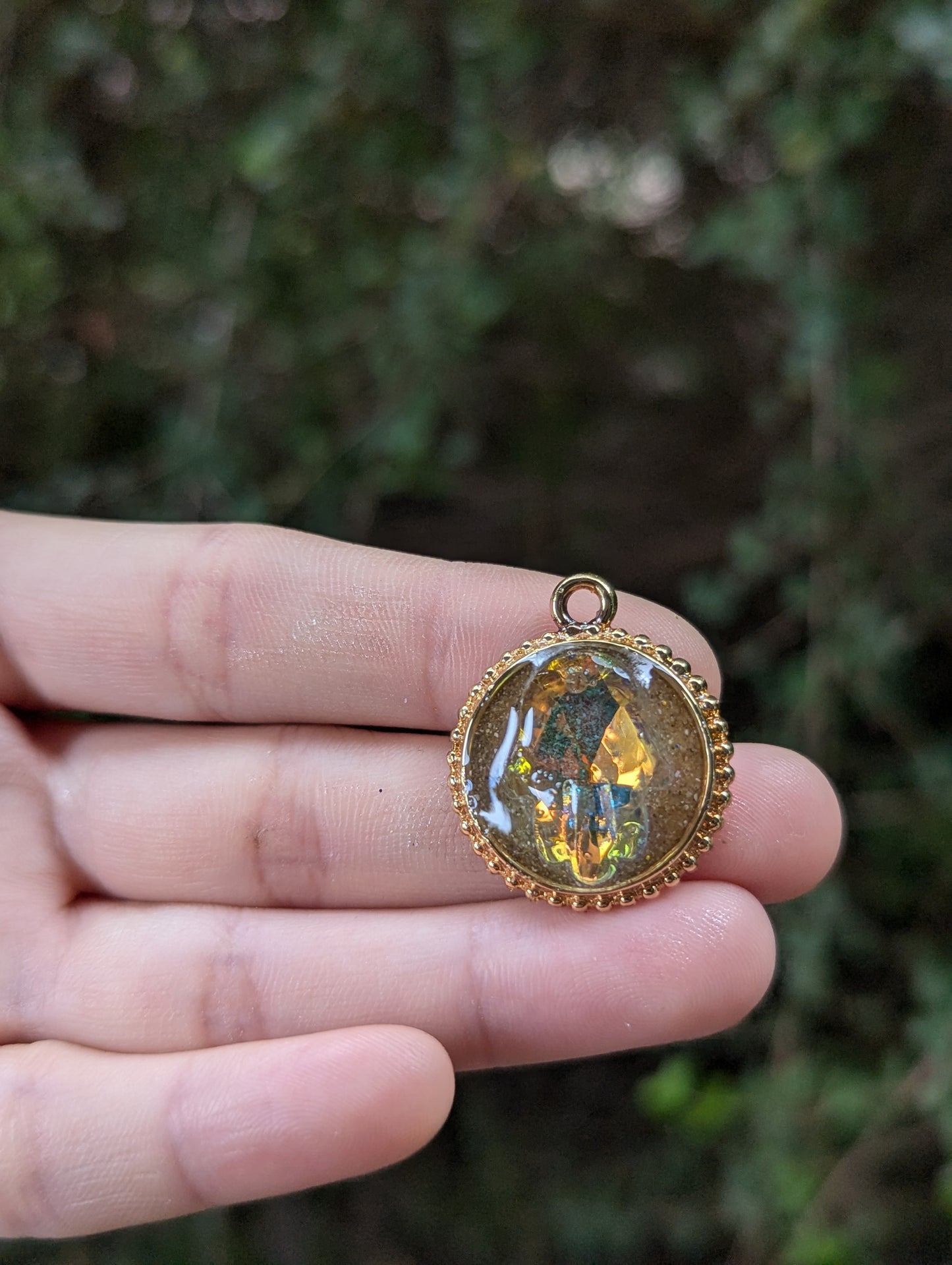Israel Encapsulated: Hamsa Pendant, Golden Sand Resin and Gold Plated Circular Frame