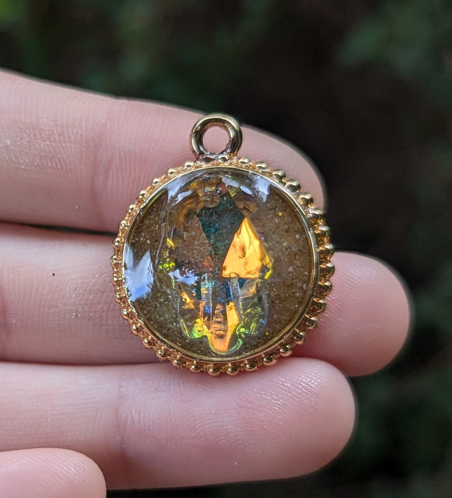 Israel Encapsulated: Hamsa Pendant, Golden Sand Resin and Gold Plated Circular Frame