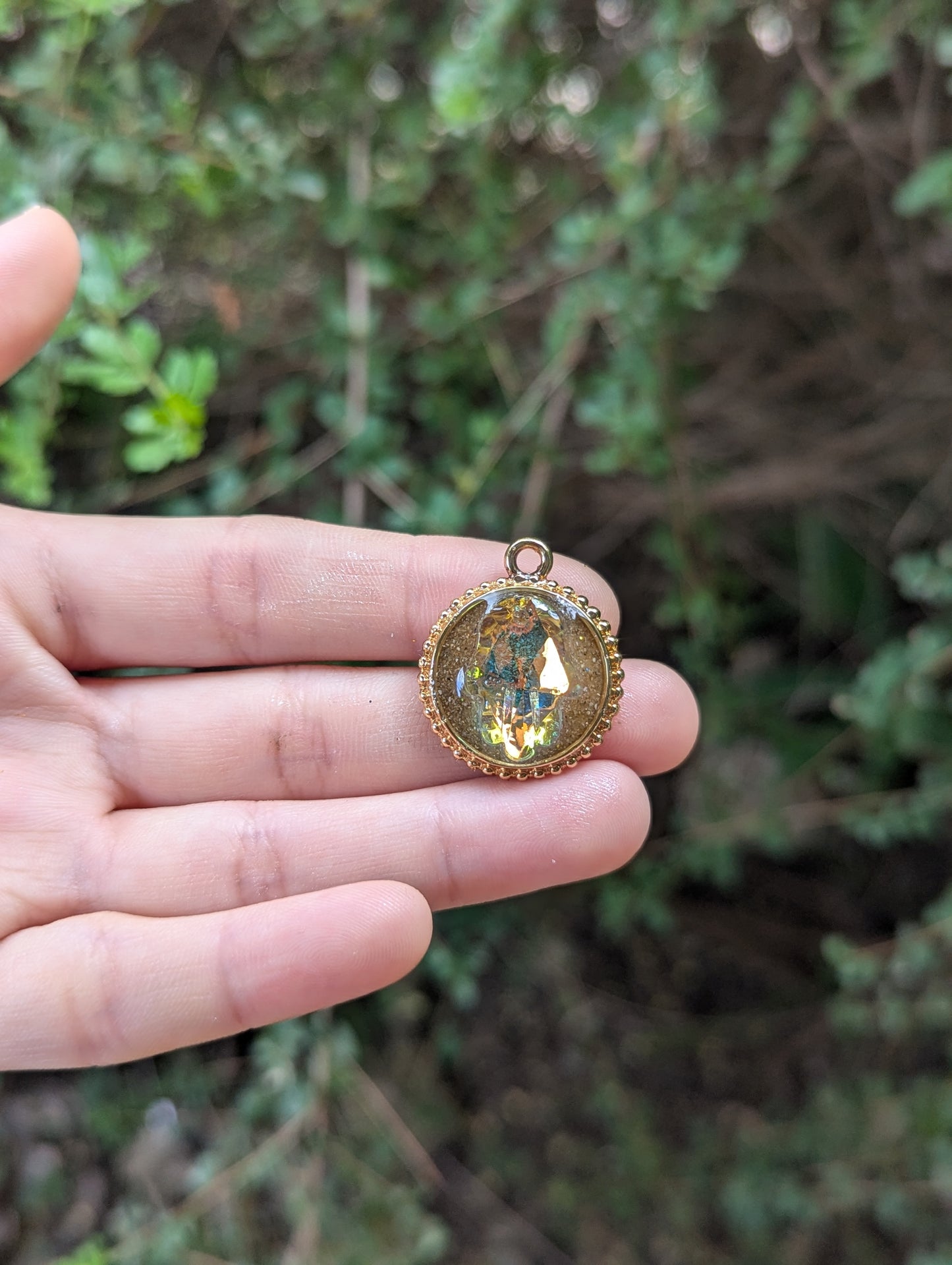 Israel Encapsulated: Hamsa Pendant, Golden Sand Resin and Gold Plated Circular Frame