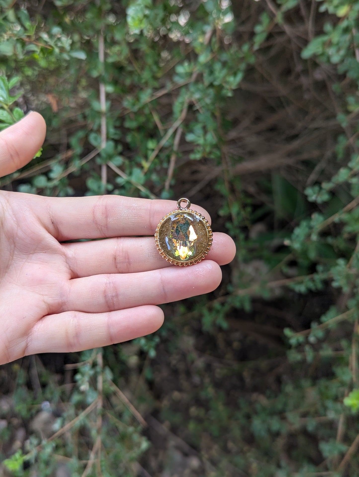 Israel Encapsulated: Hamsa Pendant, Golden Sand Resin and Gold Plated Circular Frame
