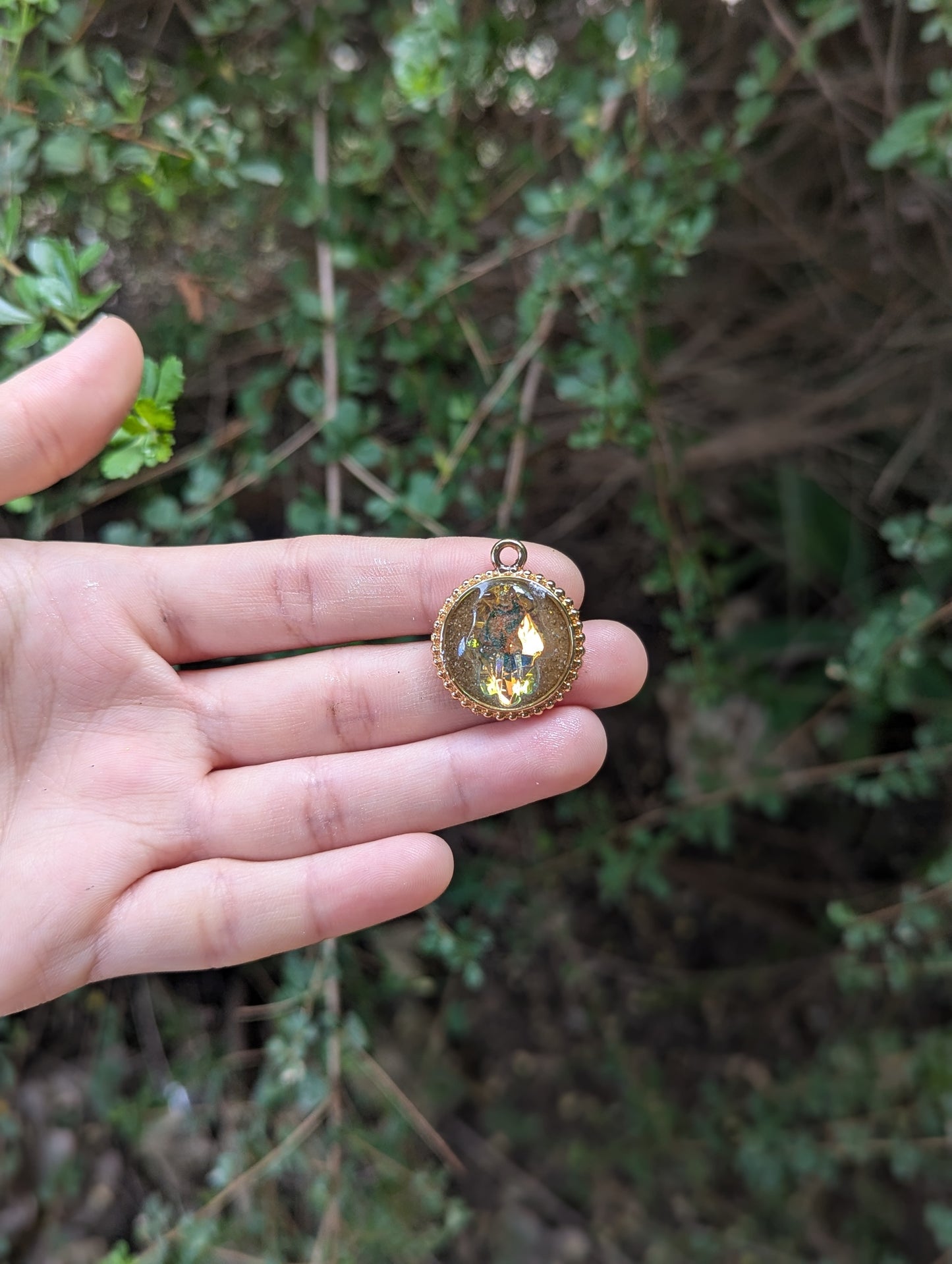 Israel Encapsulated: Hamsa Pendant, Golden Sand Resin and Gold Plated Circular Frame
