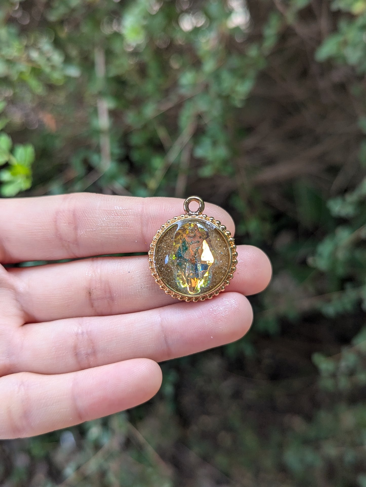 Israel Encapsulated: Hamsa Pendant, Golden Sand Resin and Gold Plated Circular Frame