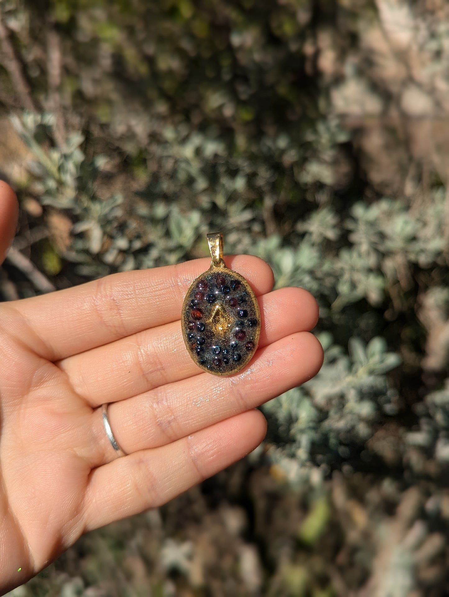 Gold Plated Hamsa, Garnet Gemstones and Blue Glass Beads Resin Pendant