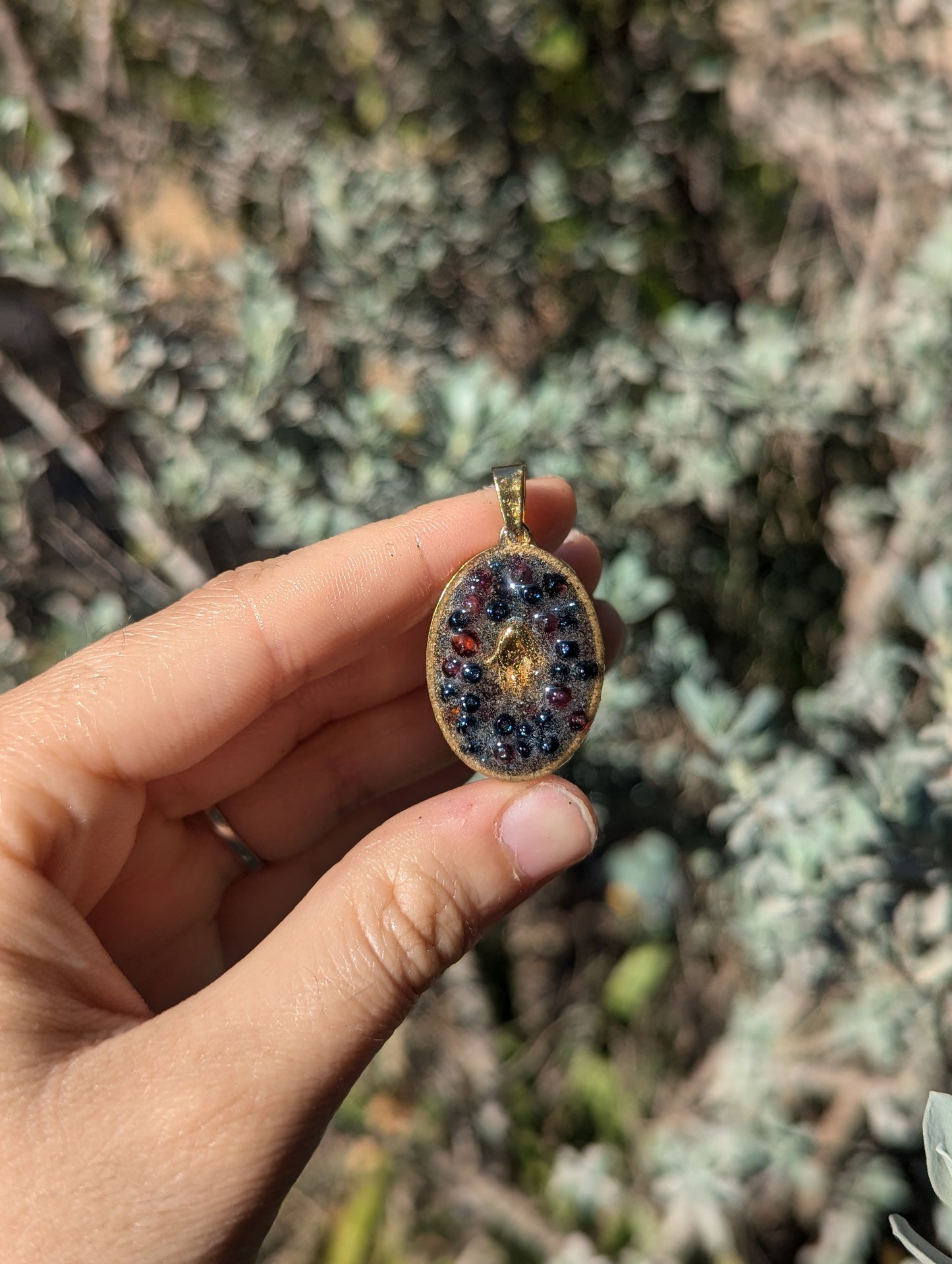 Gold Plated Hamsa, Garnet Gemstones and Blue Glass Beads Resin Pendant