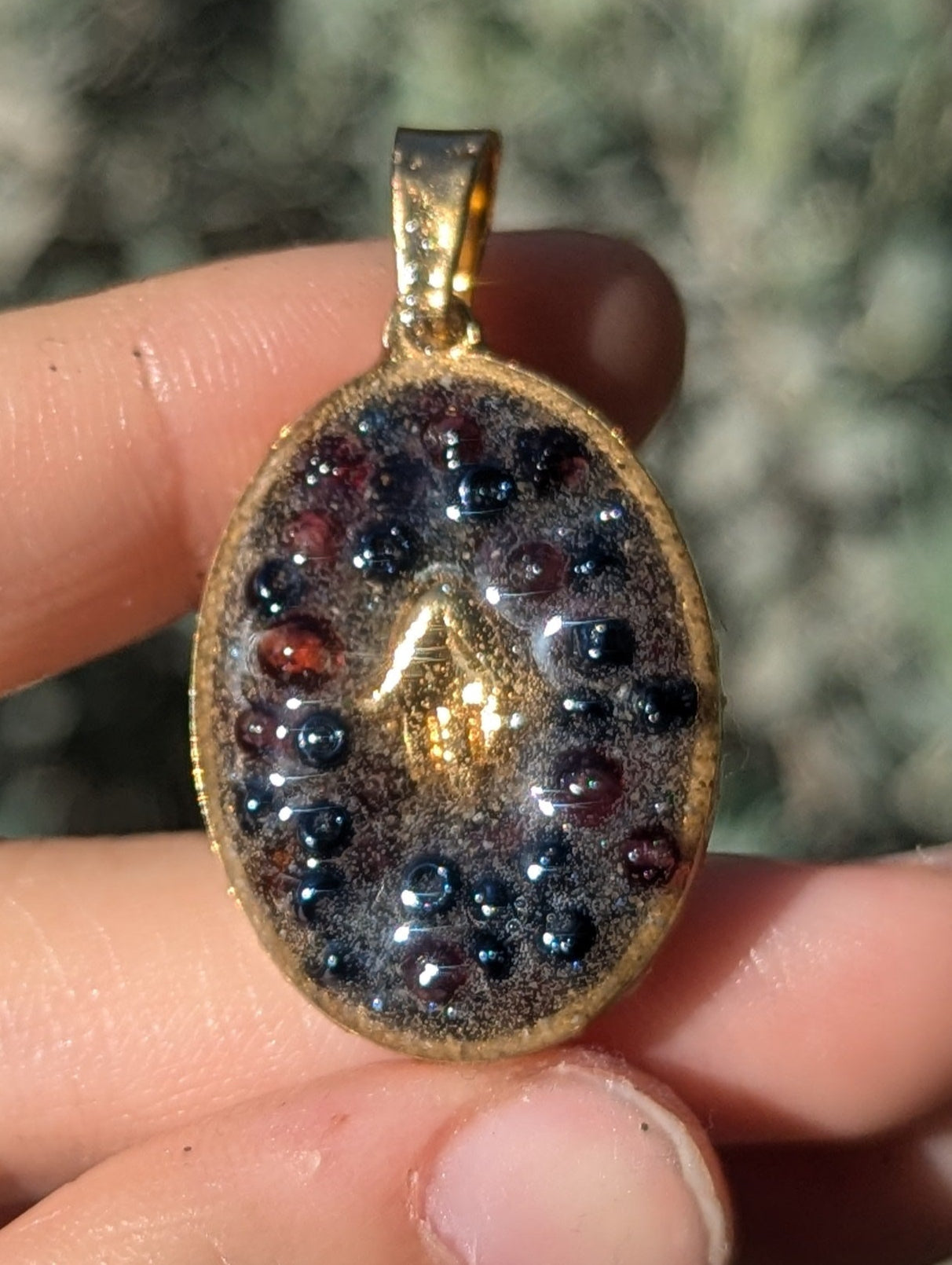 Gold Plated Hamsa, Garnet Gemstones and Blue Glass Beads Resin Pendant