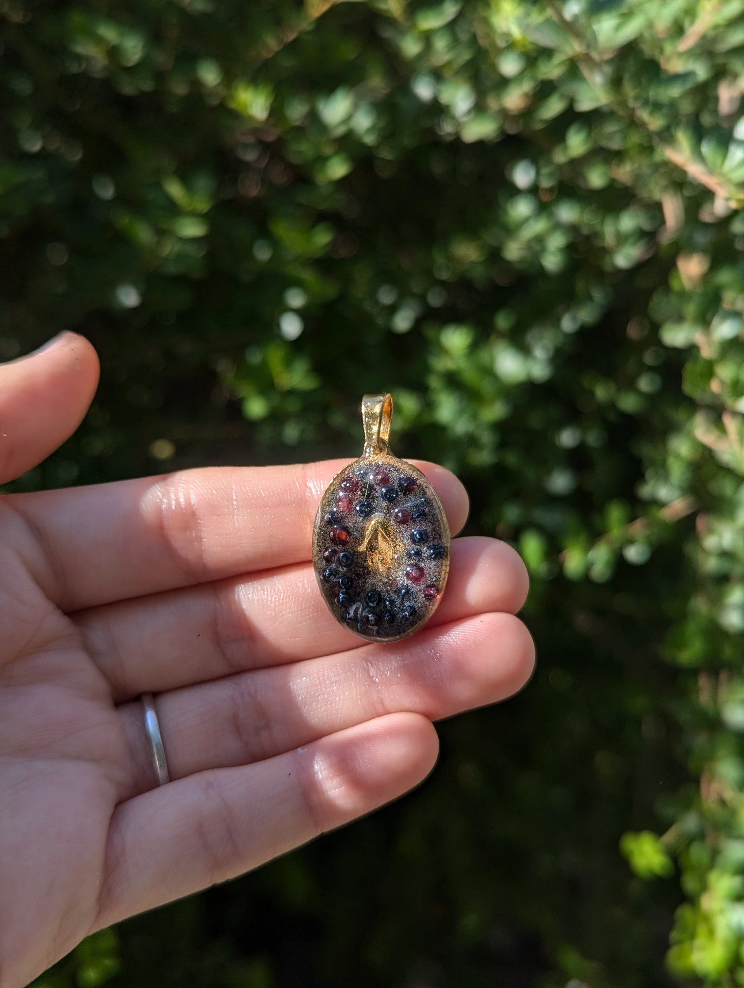 Gold Plated Hamsa, Garnet Gemstones and Blue Glass Beads Resin Pendant