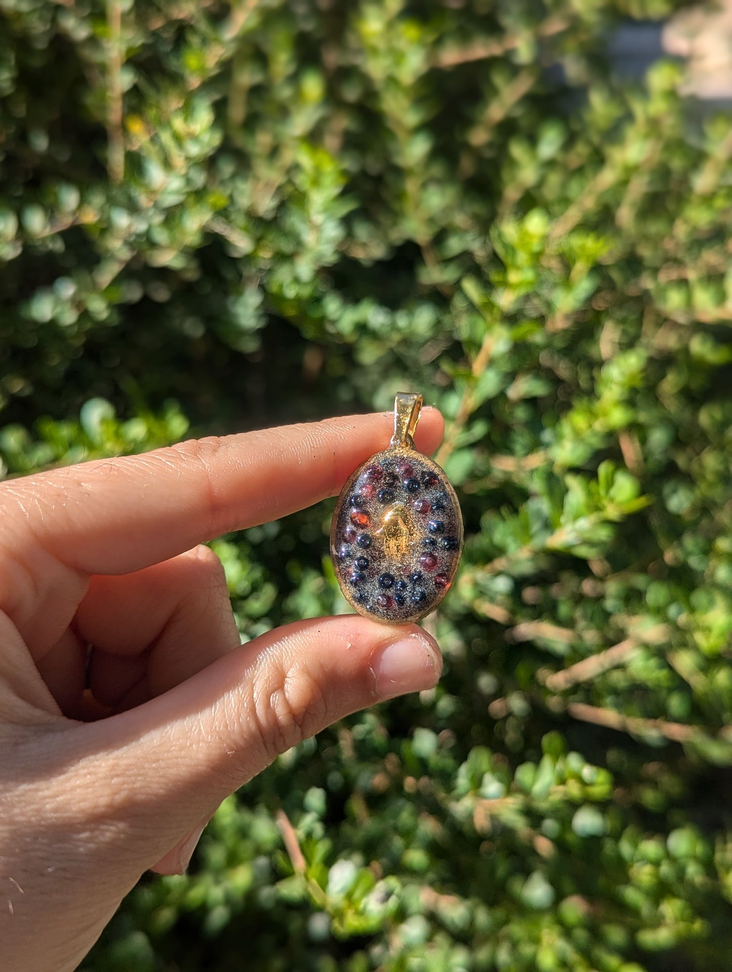 Gold Plated Hamsa, Garnet Gemstones and Blue Glass Beads Resin Pendant