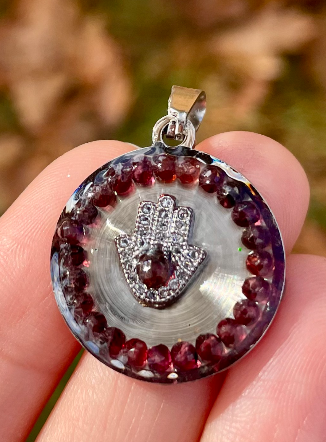 Garnet Gemstones & Silver Zirconia Hamsa Resin Round Stainless Pendant