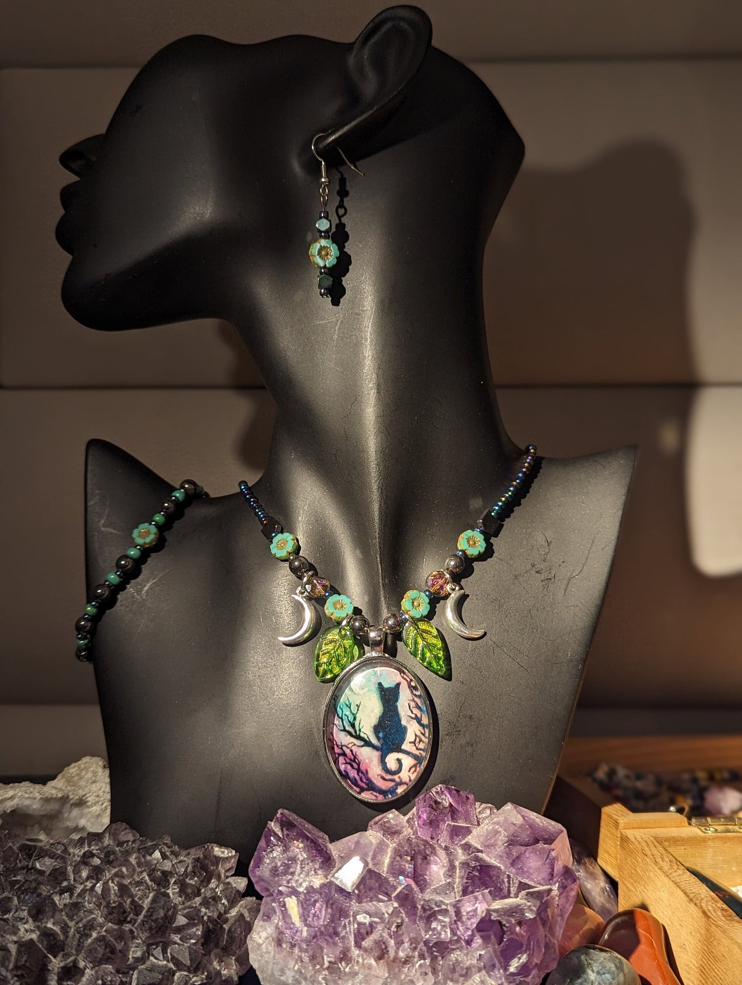 Black Cat on a Tree Branch, Purple Green Sky with Crescent Silver Moons, Green Leaf Pendants and Czech Crystal Flower Bracelet and Earrings