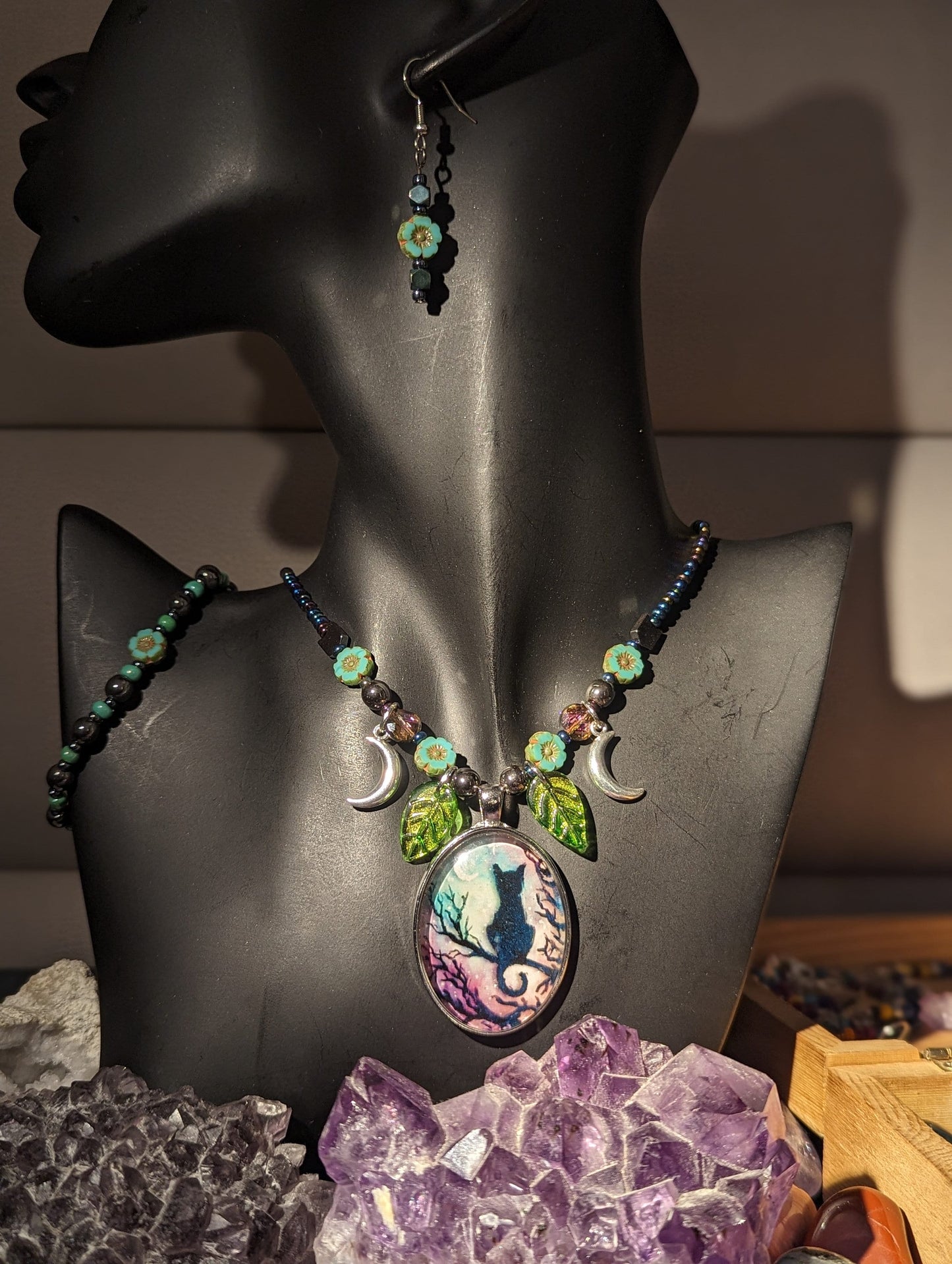 Black Cat on a Tree Branch, Purple Green Sky with Crescent Silver Moons, Green Leaf Pendants and Czech Crystal Flower Bracelet and Earrings