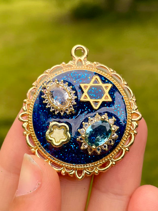 Gema: Stars Magen David with Zirconia, blue and Gold plated Resin Pendant