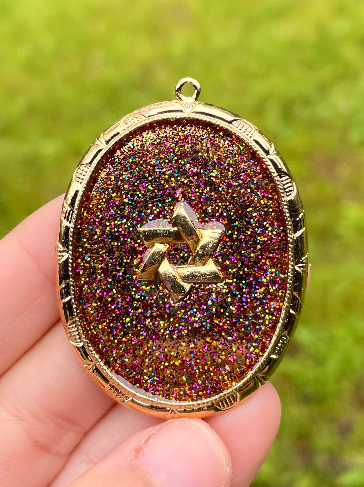 Andromeda Galaxy Pendant: Oval Gold plated pendant with Magen David and Glittery Shine