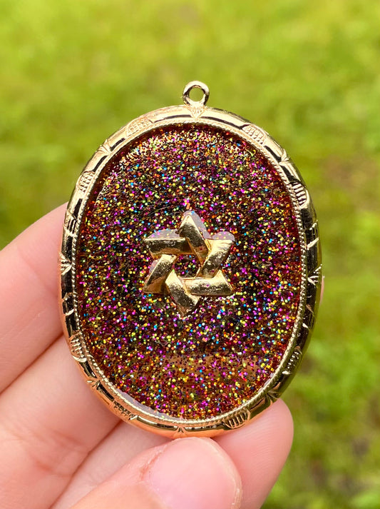 Andromeda Galaxy Pendant: Oval Gold plated pendant with Magen David and Glittery Shine