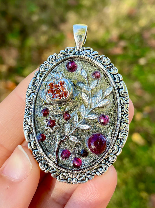 Pomegranate, Garnets, silver leaves and Magen David in resin.