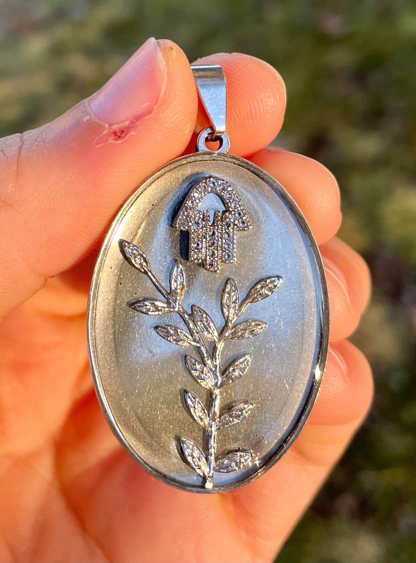 Zirconia Hamsa and Silver leaves Resin Oval Stainless Pendant