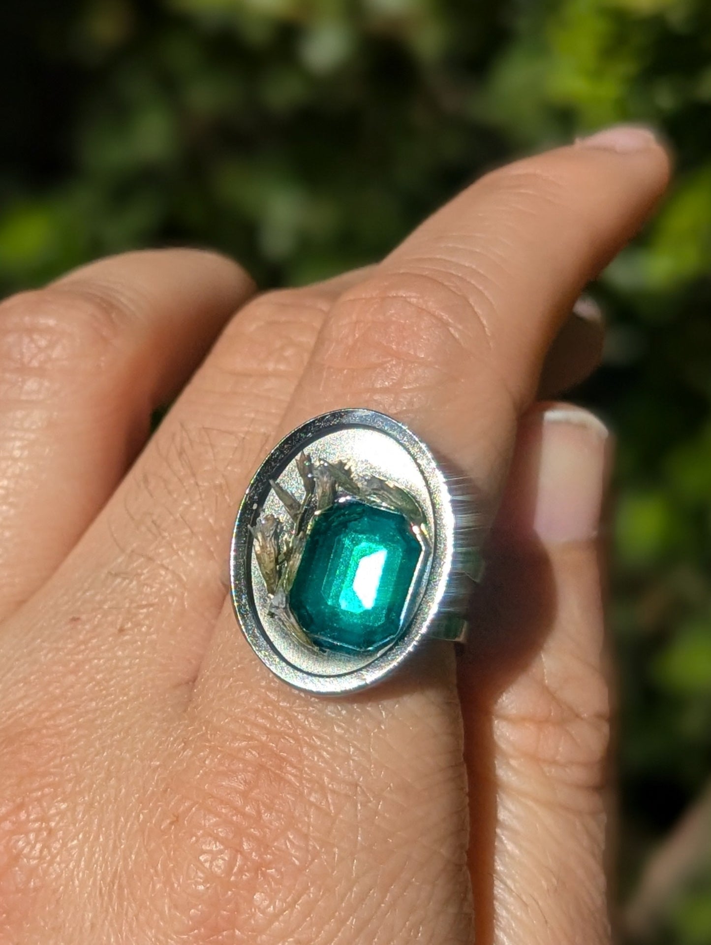 Israel Encapsulated: Tiny Israeli Flowers and Green Zirconia in Resin Stainless Steel Ring