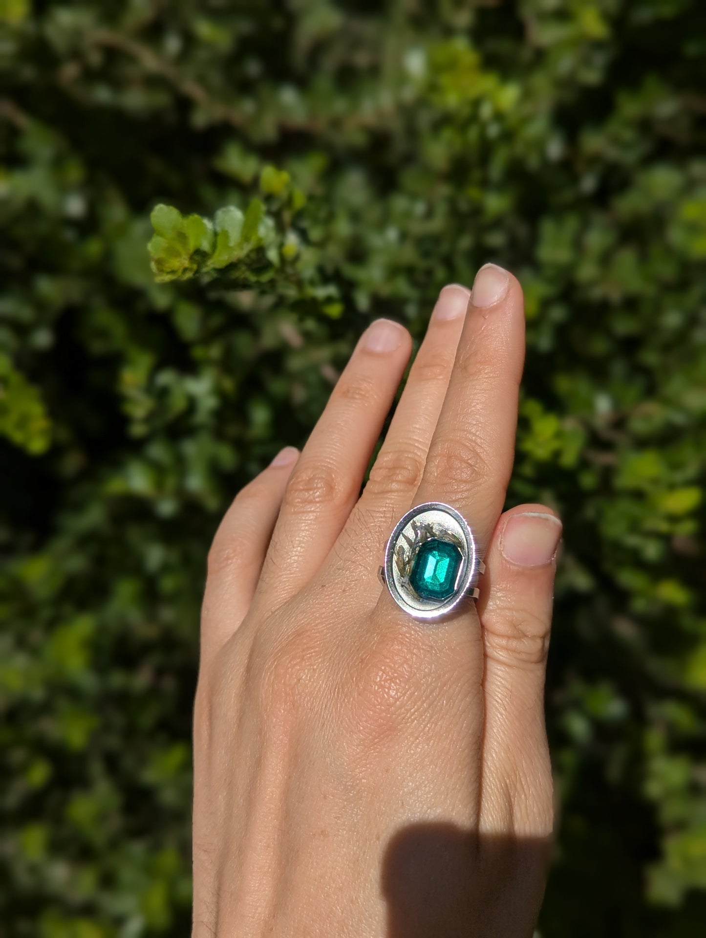 Israel Encapsulated: Tiny Israeli Flowers and Green Zirconia in Resin Stainless Steel Ring