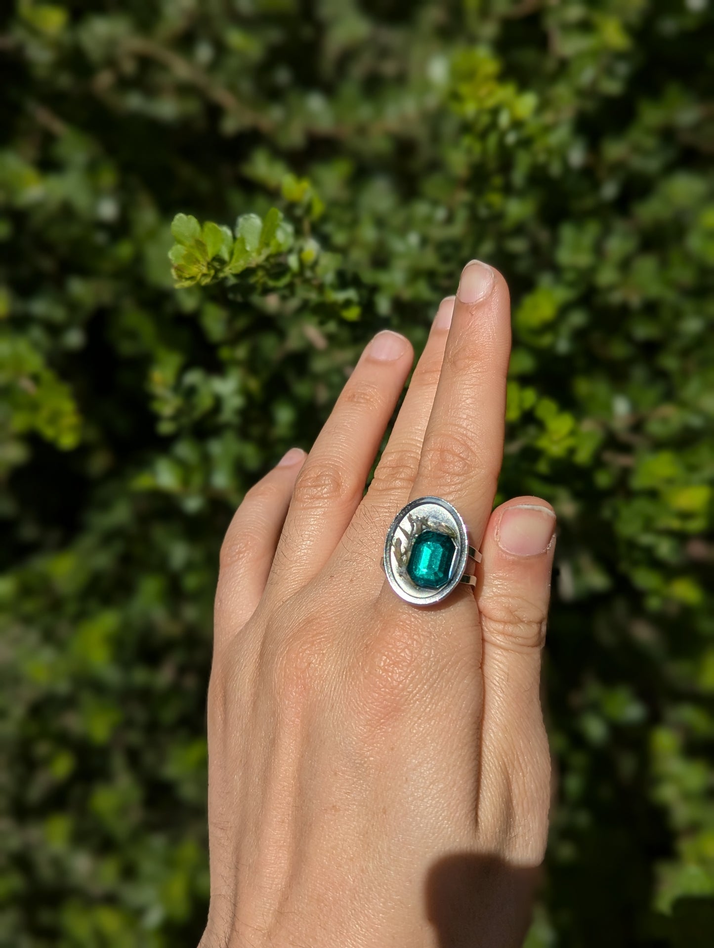 Israel Encapsulated: Tiny Israeli Flowers and Green Zirconia in Resin Stainless Steel Ring