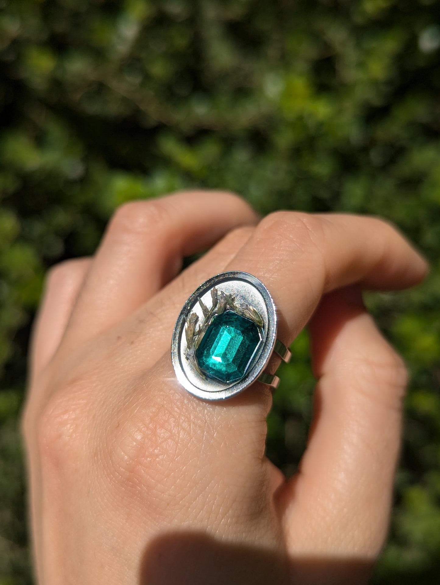 Israel Encapsulated: Tiny Israeli Flowers and Green Zirconia in Resin Stainless Steel Ring