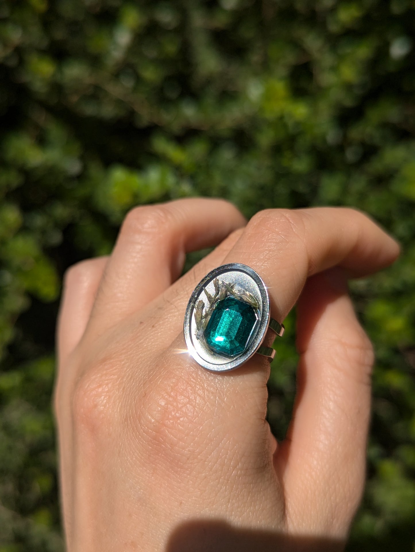 Israel Encapsulated: Tiny Israeli Flowers and Green Zirconia in Resin Stainless Steel Ring