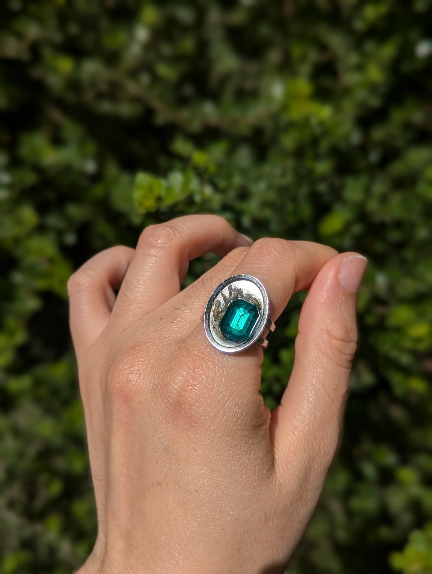 Israel Encapsulated: Tiny Israeli Flowers and Green Zirconia in Resin Stainless Steel Ring