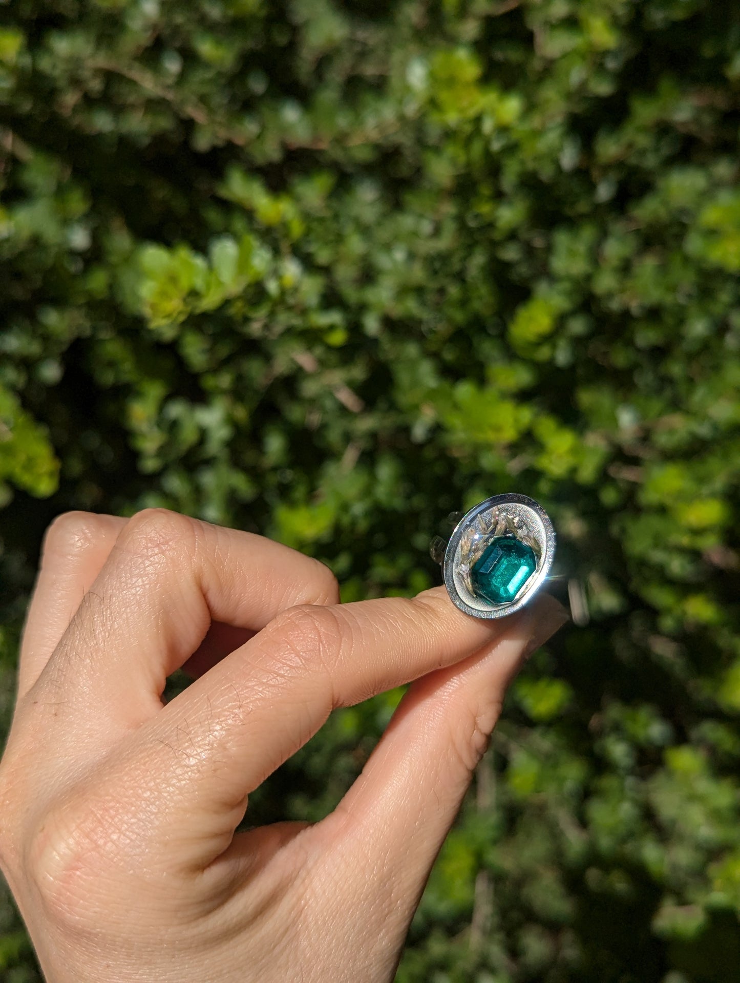 Israel Encapsulated: Tiny Israeli Flowers and Green Zirconia in Resin Stainless Steel Ring
