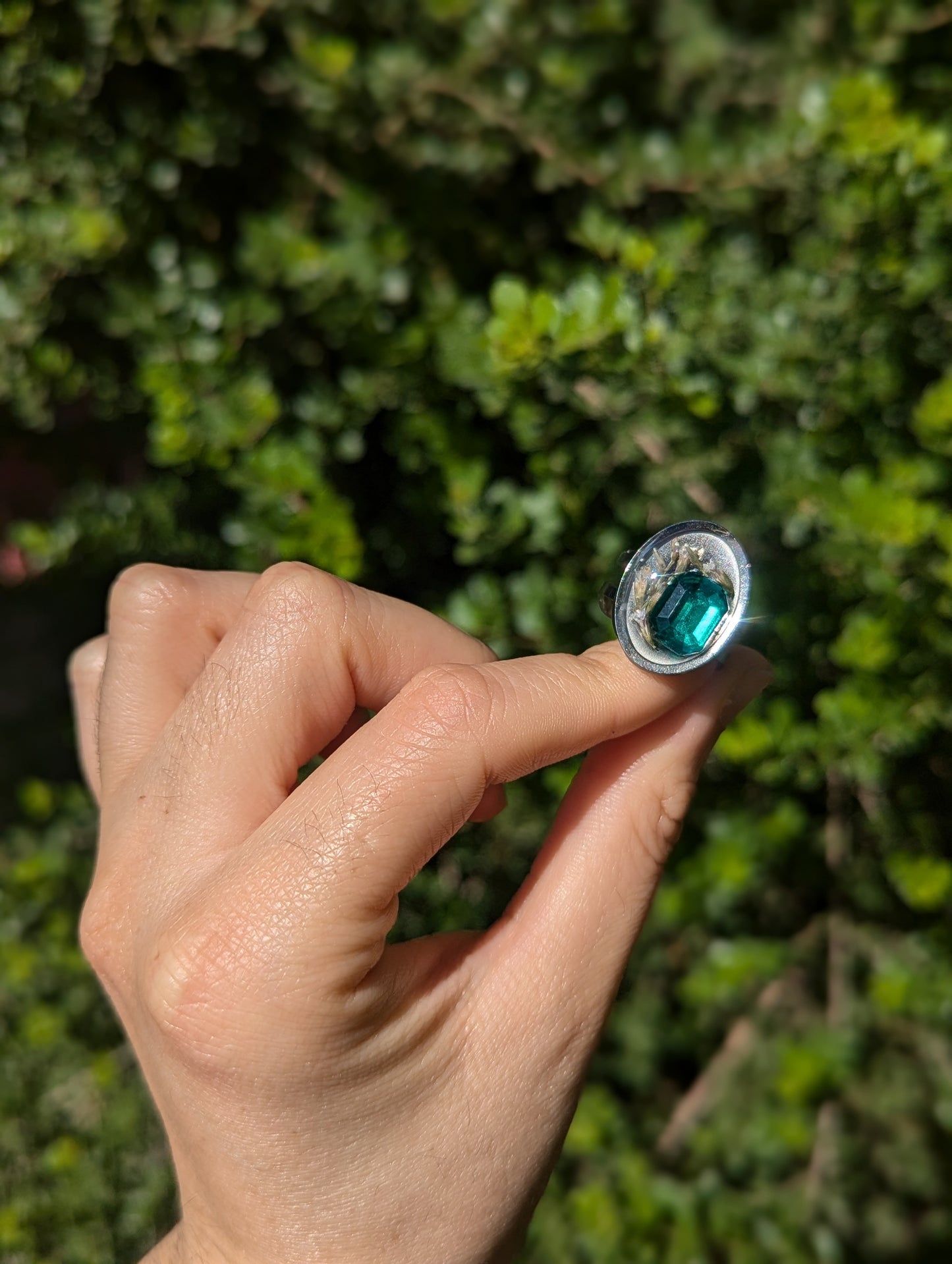 Israel Encapsulated: Tiny Israeli Flowers and Green Zirconia in Resin Stainless Steel Ring