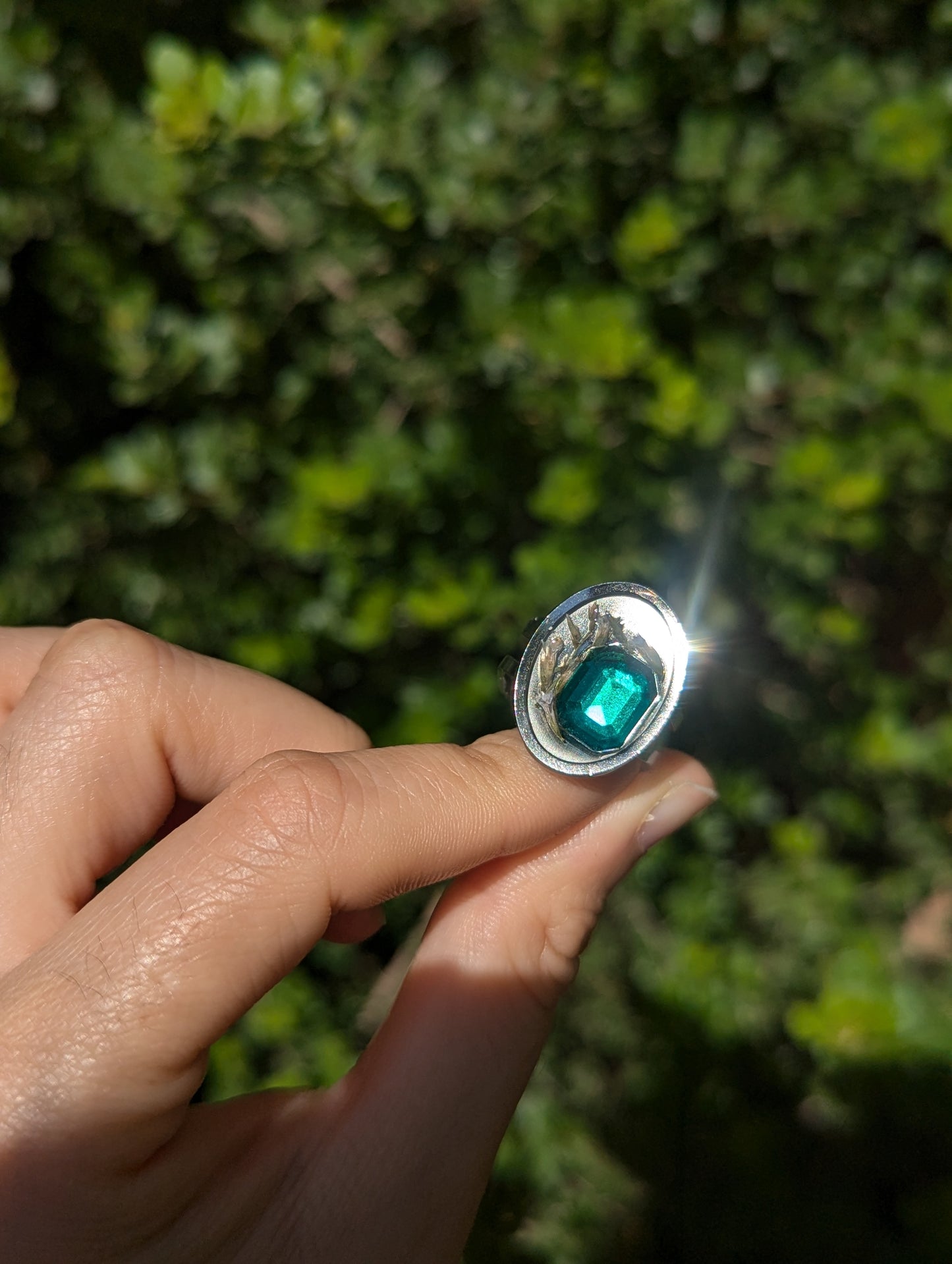 Israel Encapsulated: Tiny Israeli Flowers and Green Zirconia in Resin Stainless Steel Ring