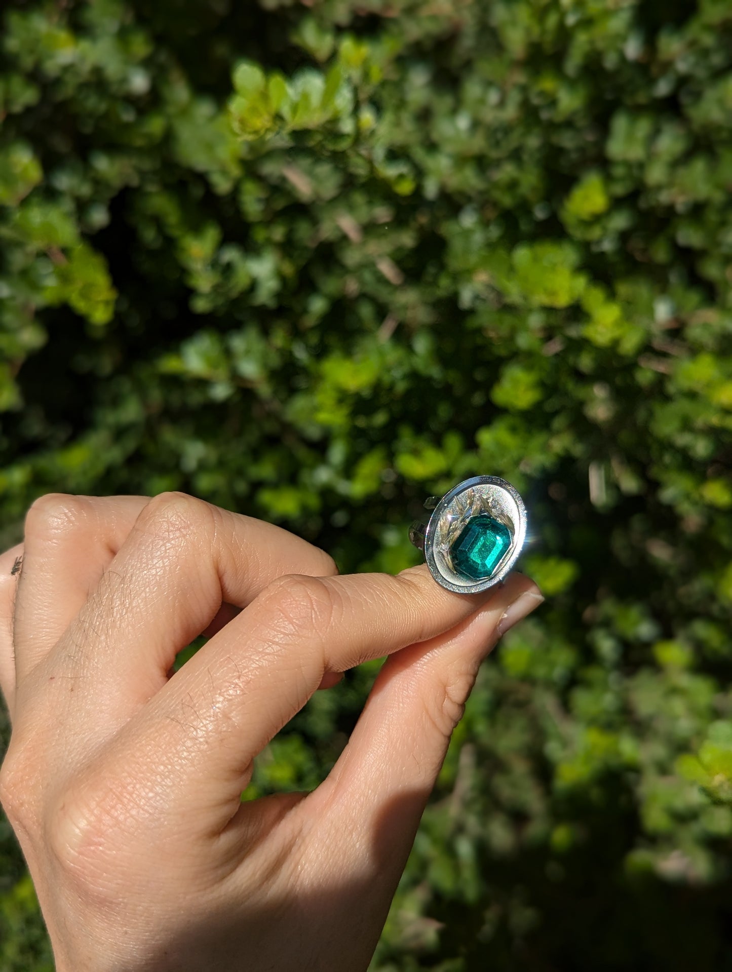 Israel Encapsulated: Tiny Israeli Flowers and Green Zirconia in Resin Stainless Steel Ring