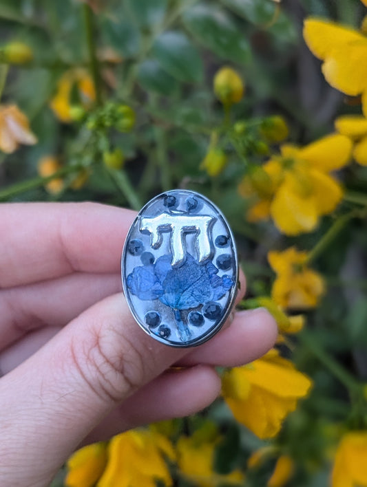 Nava: Israeli Blue Flower, Silver Chai and Sapphire Gemstone Beads Large Oval Resin Adjustable Ring