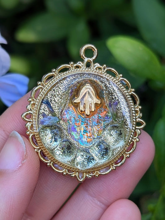Purity: Swarovski Beads, Hamsa Gold Plated and Glass Pendants and Tiny Israeli Purple Flowers in Decorated Round Resin Pendant