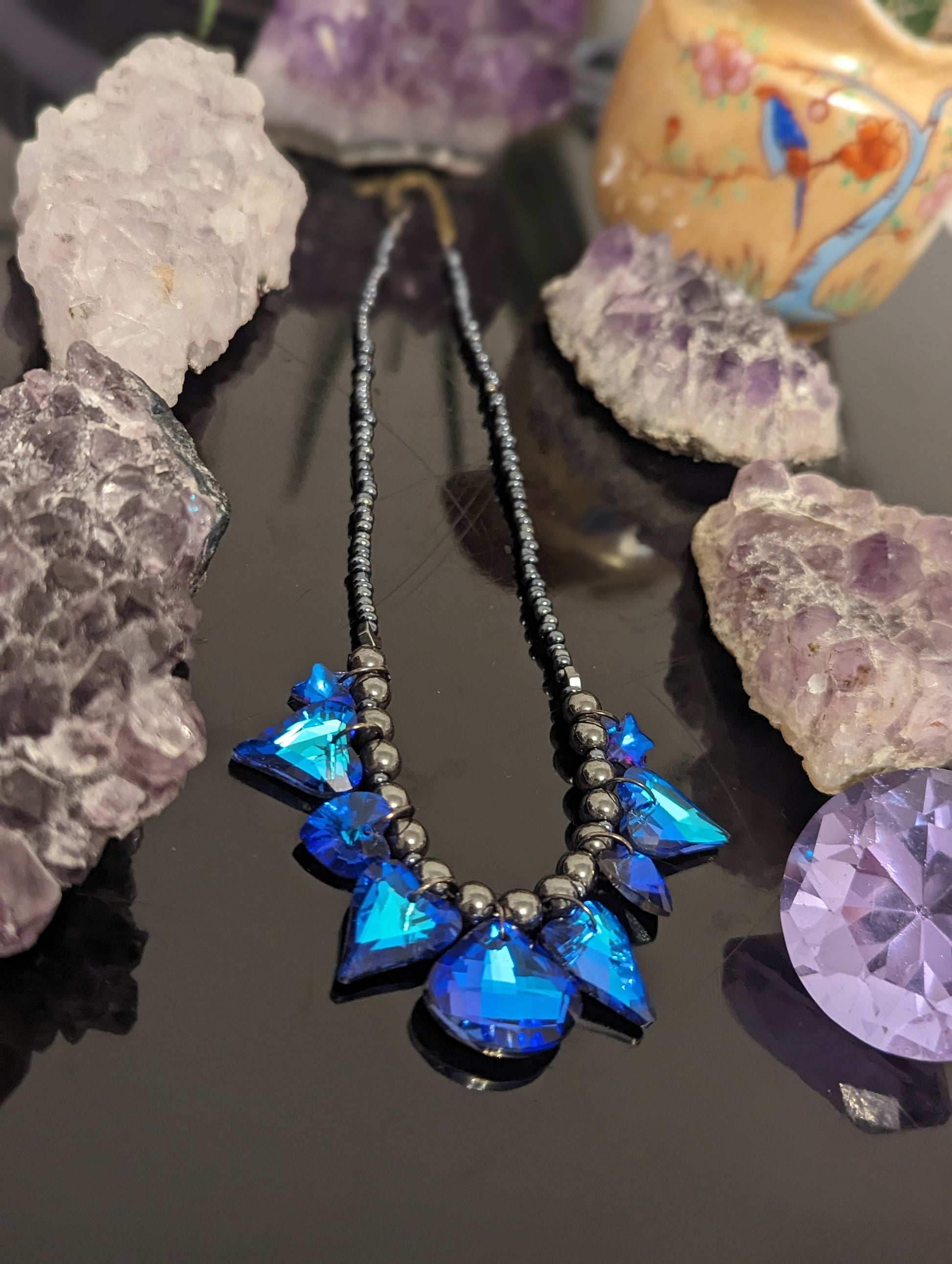 Night Love Composition: 9 Blue Heart, Star and Soft Triangle Pendants, Grey Hematite Styled Beads, Dark Blue Glass Beads.