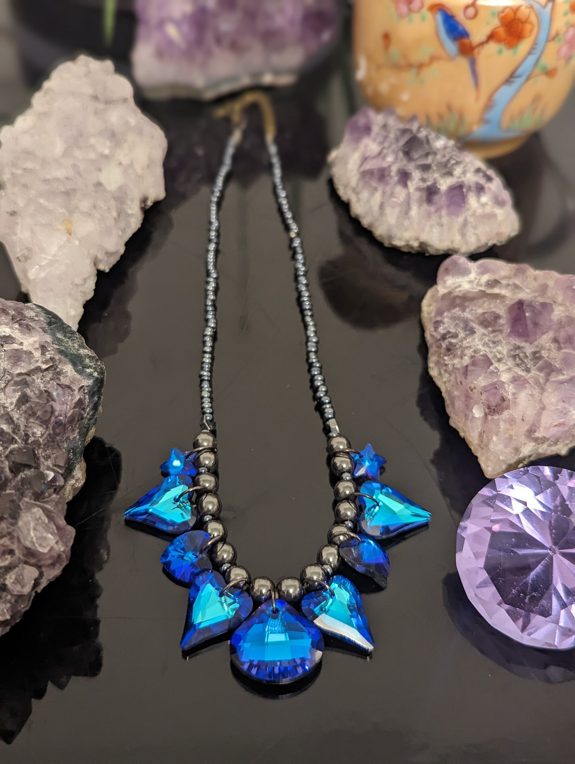 Night Love Composition: 9 Blue Heart, Star and Soft Triangle Pendants, Grey Hematite Styled Beads, Dark Blue Glass Beads.